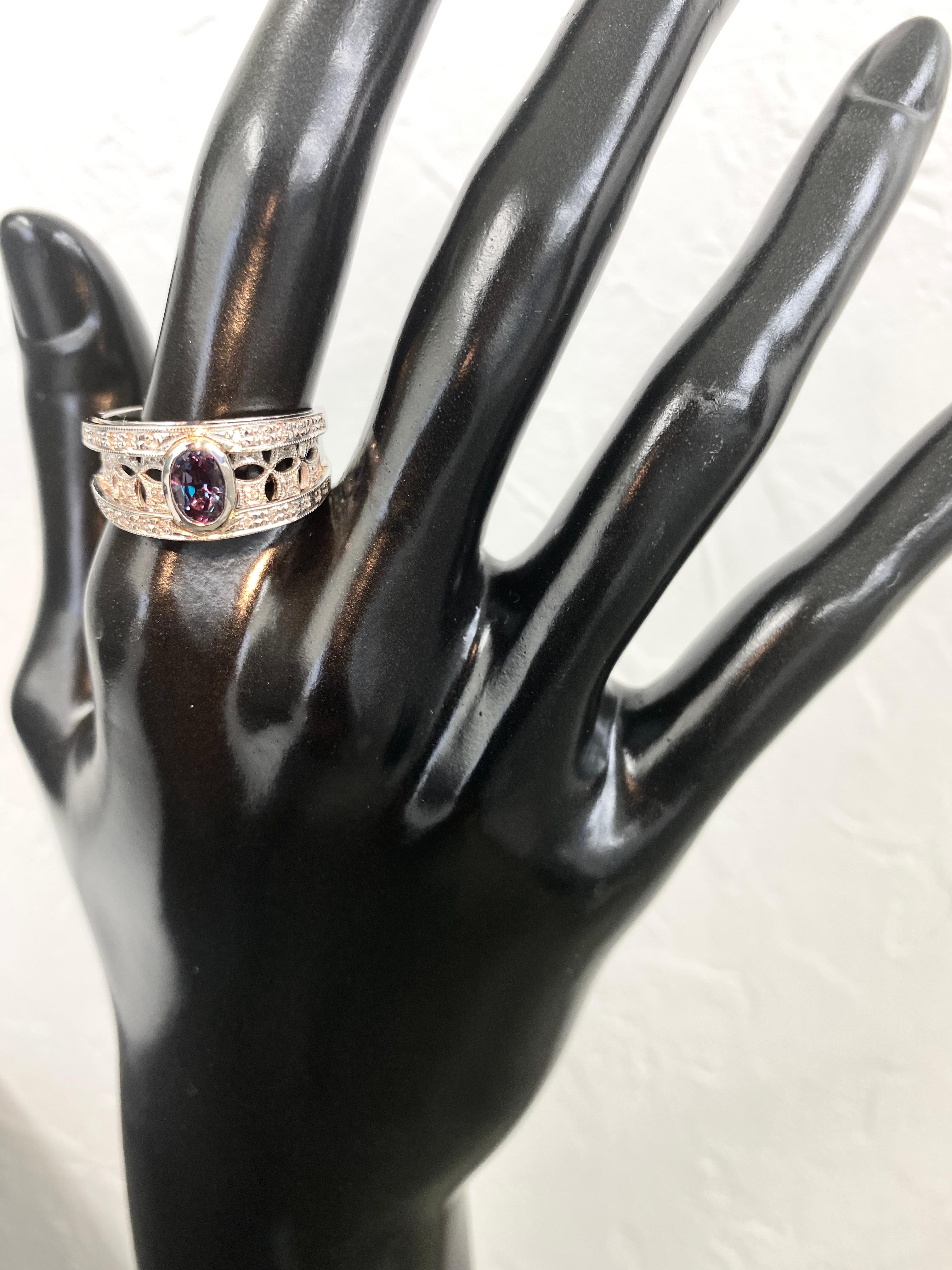 A gorgeous Band Ring featuring 0.61 Carat, Natural Alexandrite and 0.18 Carats of Diamond Accents set in Platinum. Alexandrites produce a natural color-change phenomenon as they exhibit a Bluish Green Color under Fluorescent Light whereas a Purplish