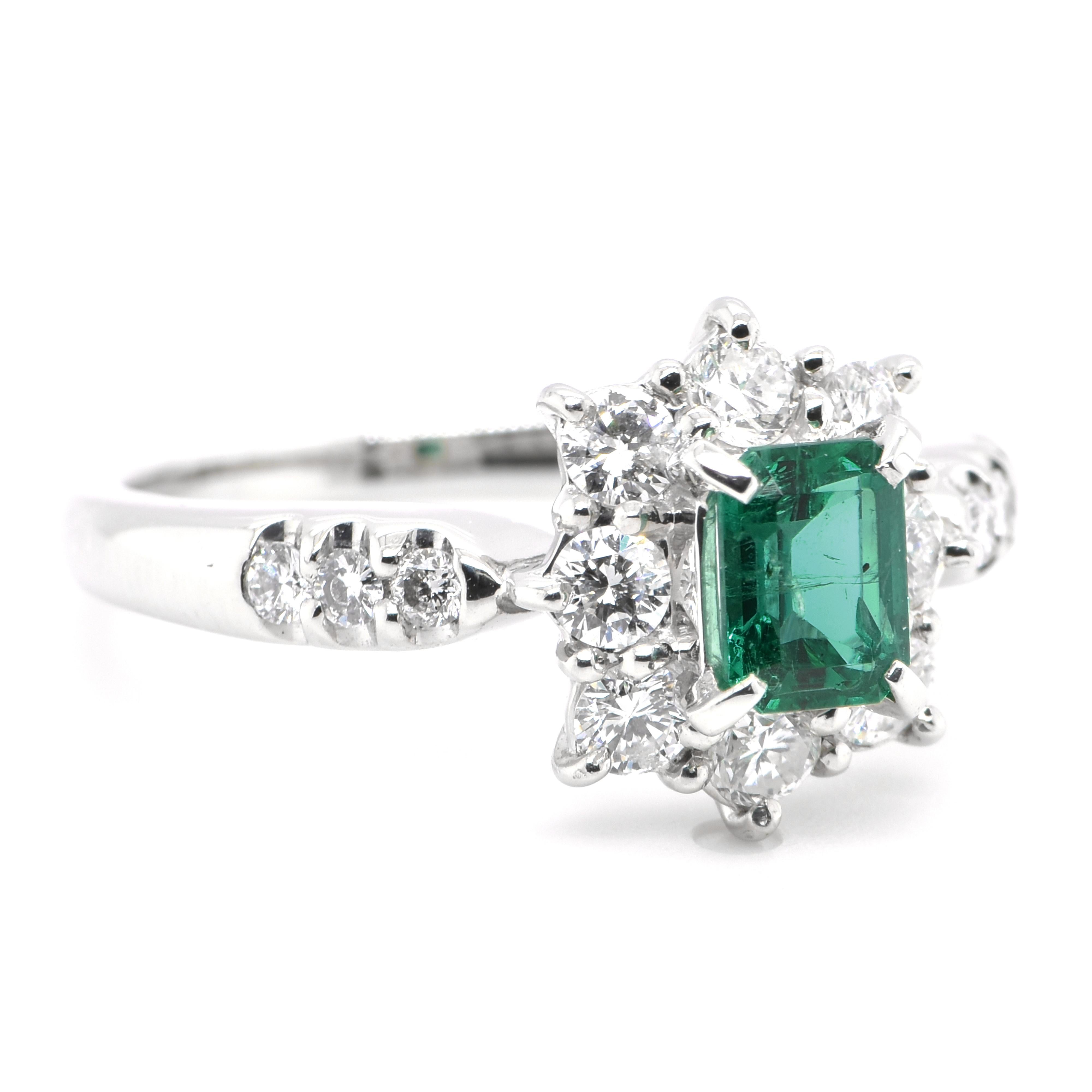 Modern 0.61 Carat Natural Emerald and Diamond Ring Set in Platinum