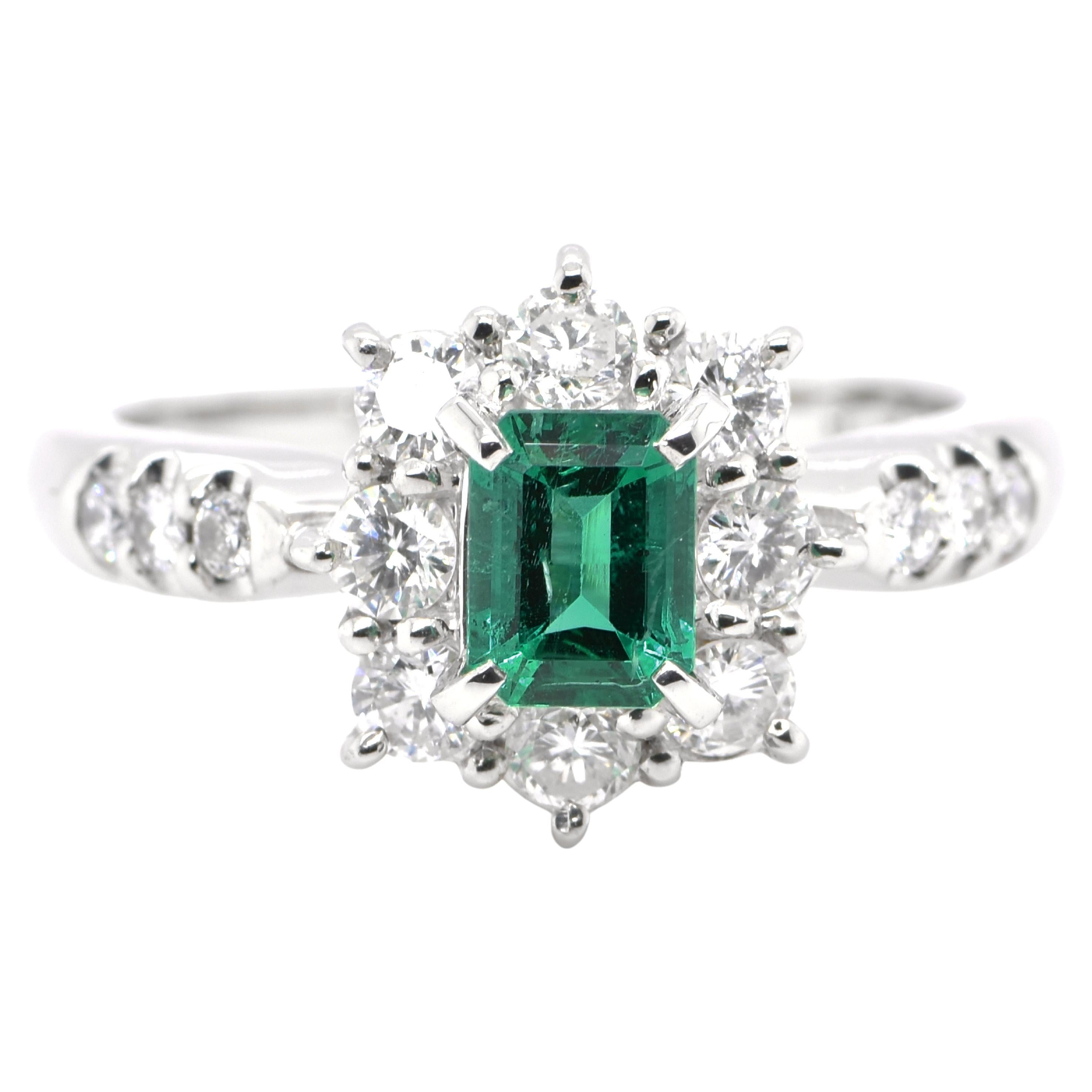0.61 Carat Natural Emerald and Diamond Ring Set in Platinum