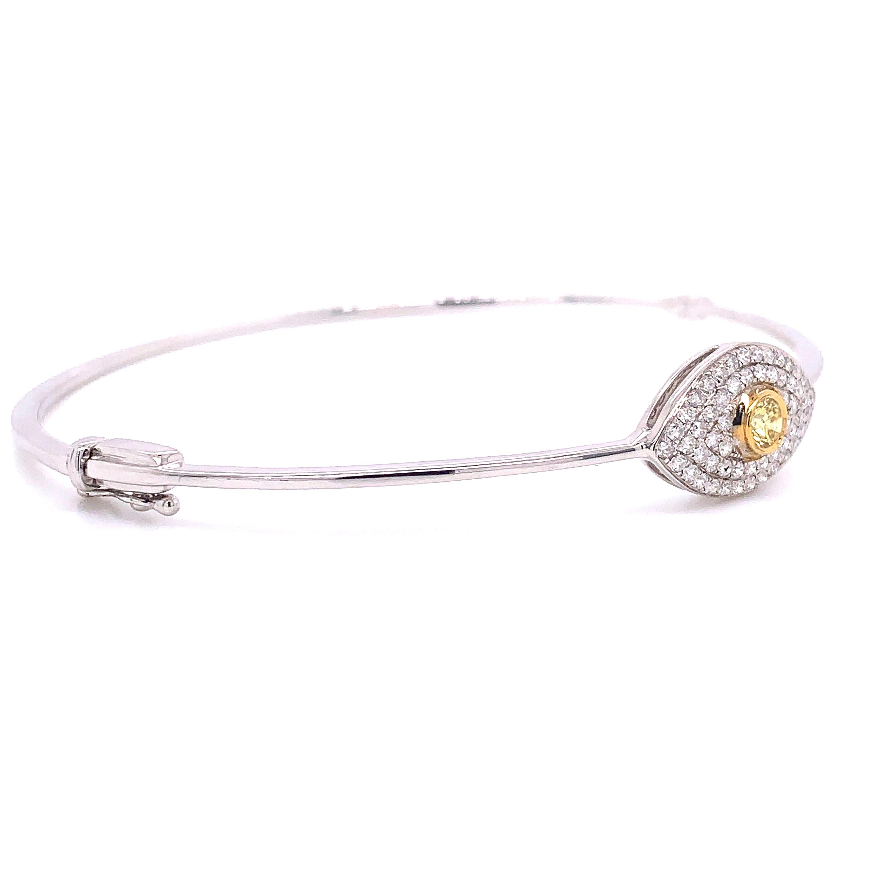 0.61 Carat Natural Fancy Yellow Diamond And White Diamond Bangle made by Shimon's Creations will delight you endlessly as you can wear it from day into night.
This affordable gorgeous and unique bangle features 0.17 carats of a natural fancy yellow