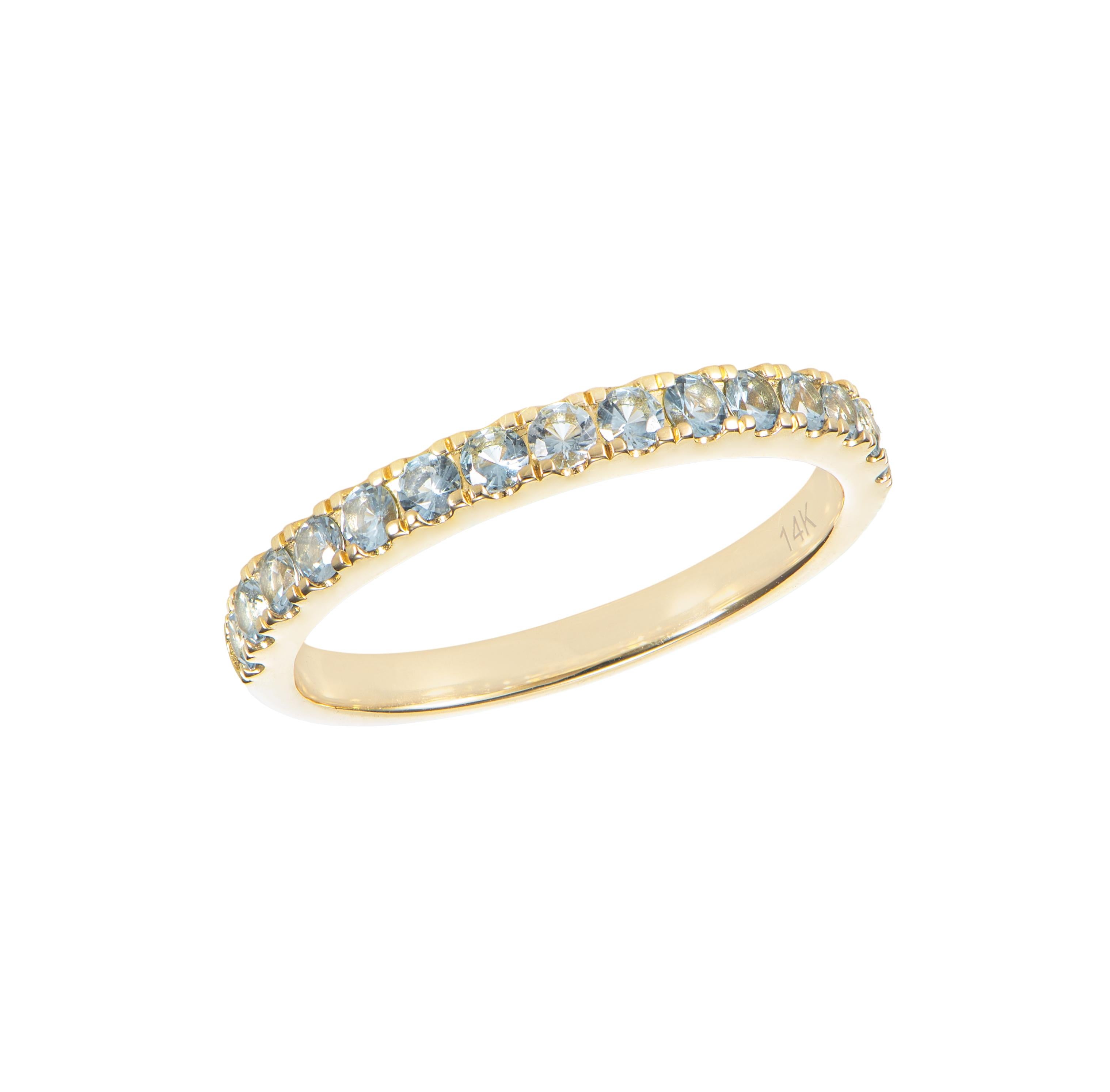 Round Cut 0.61 Carat Sky Blue Topaz Eternity Ring in 14Karat Yellow Gold. For Sale