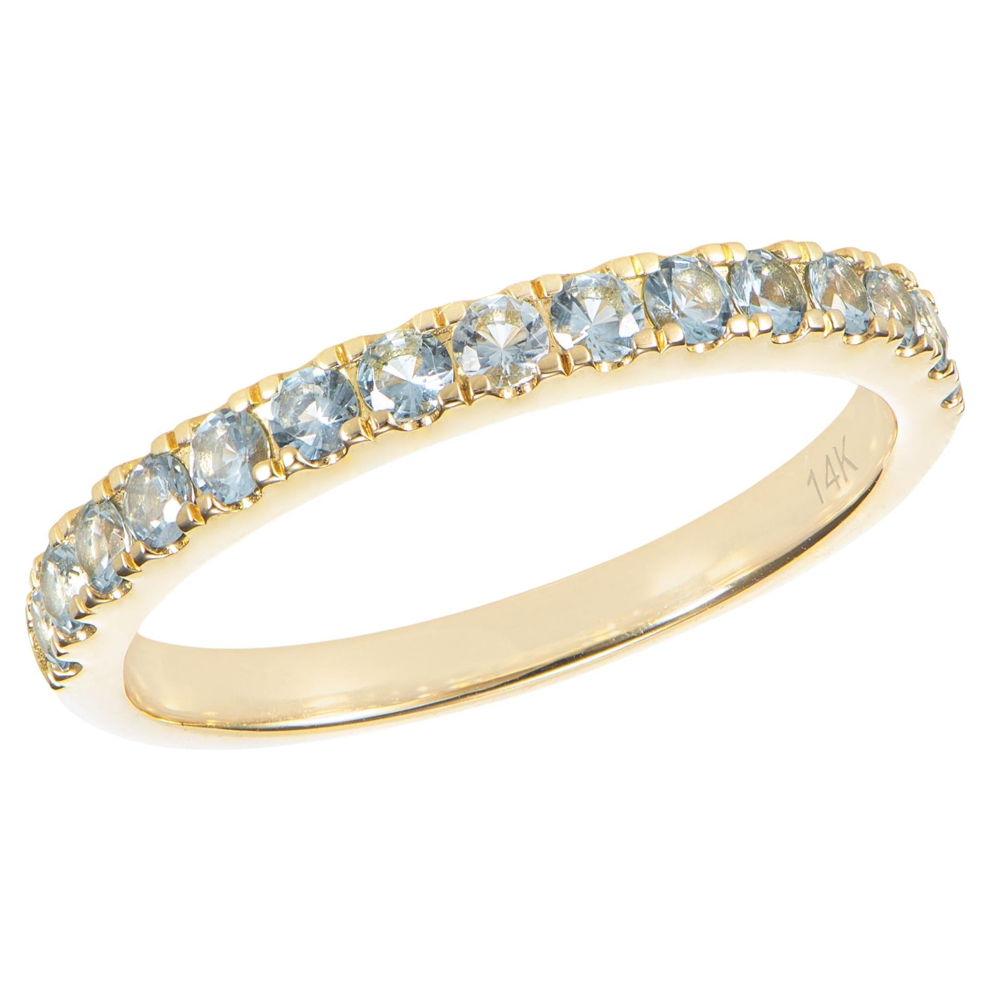0.61 Carat Sky Blue Topaz Eternity Ring in 14Karat Yellow Gold. For Sale