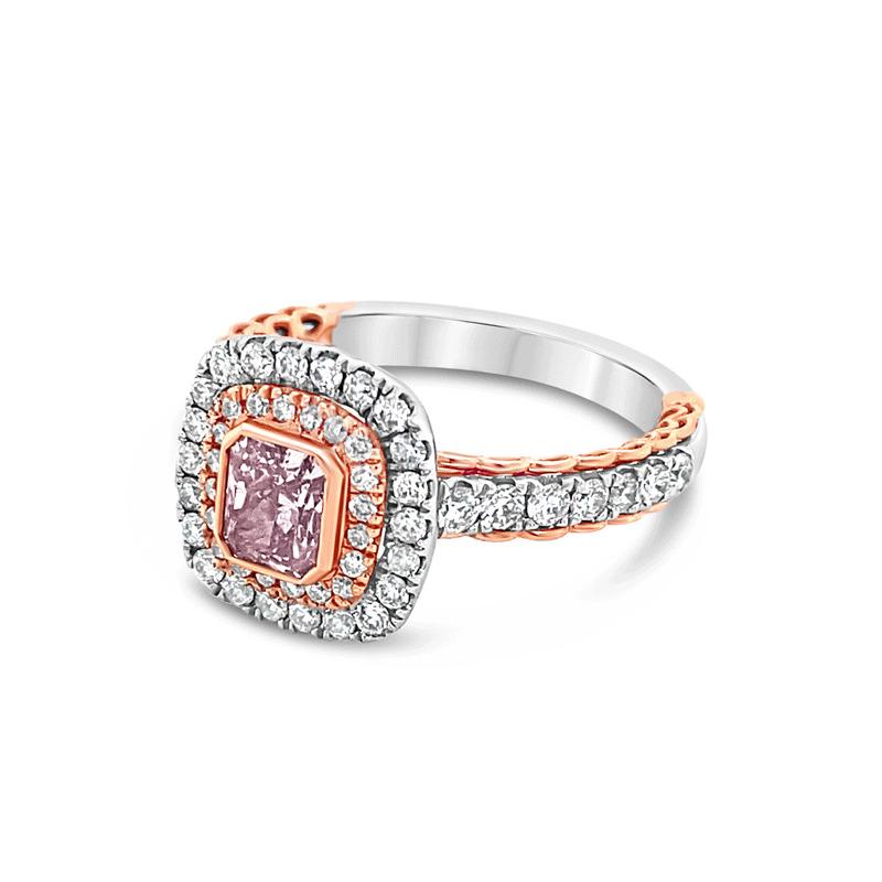 This unique modern ring features a 0.62 carat bezel set radiant cut natural fancy brownish purple-pink diamond accented by a cushion shaped double halo cathedral semi-mount with a total carat weight in 0.72 carats set in 14 karat white and rose