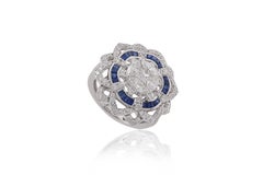 0.62 blue sapphire baguettes with 0.67 marquess and diamonds in 18 Karat Gold.