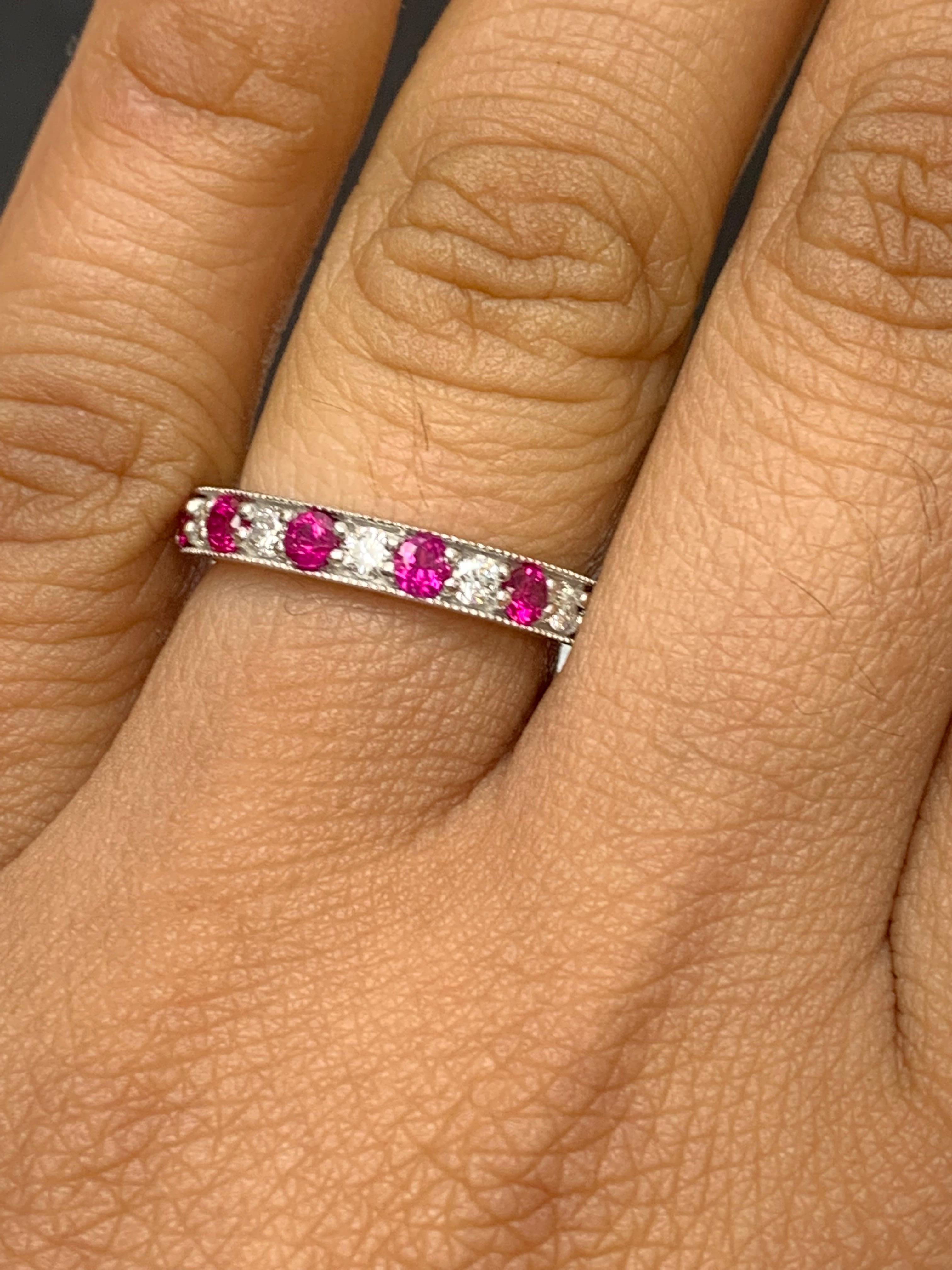 Handcrafted to perfection; showcasing color-rich brilliant-cut rubies that elegantly alternate brilliant-cut diamonds in a 14k white gold setting. 
The 7 Rubies weigh 0.62 carats total and 6 diamonds weigh 0.30 carats total.

Size 6.5 US (Sizable).