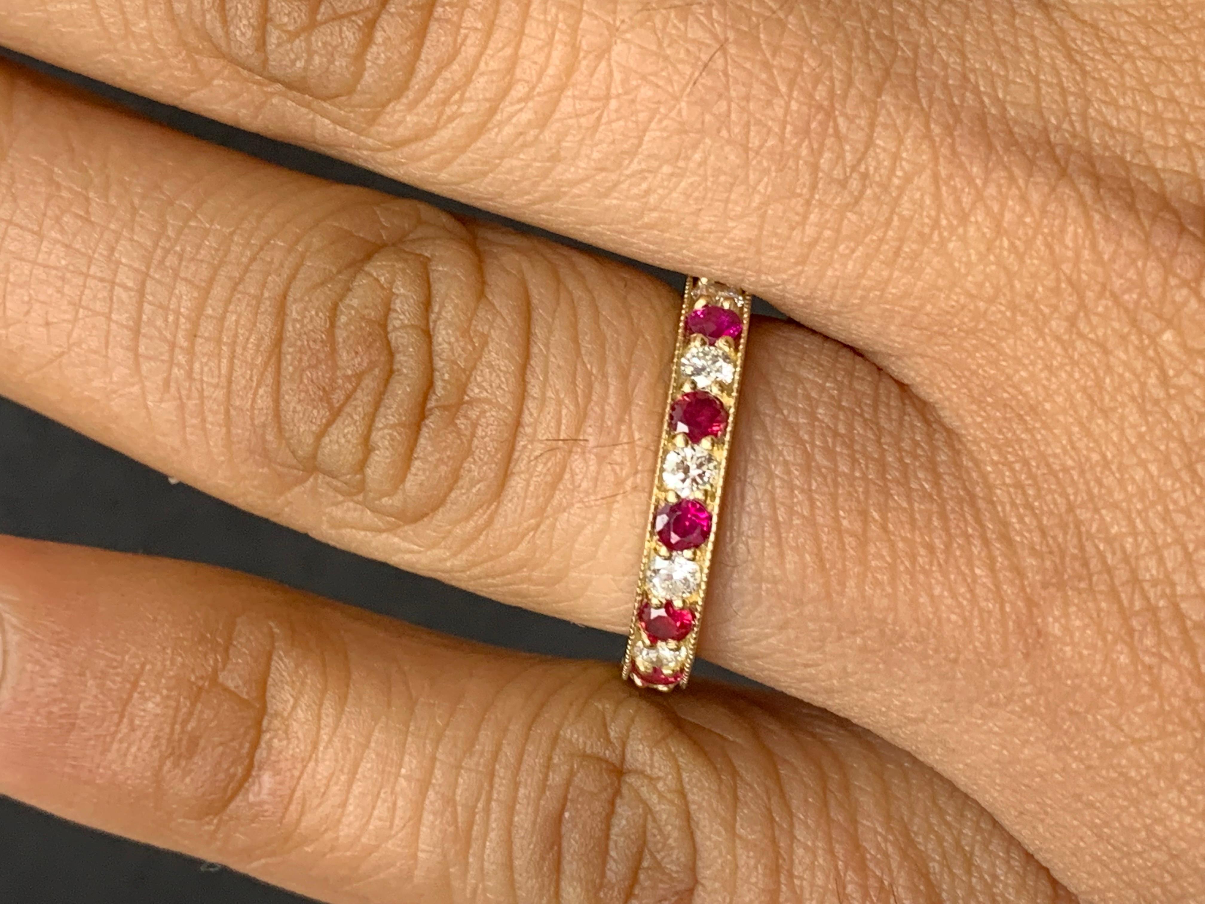 Handcrafted to perfection; showcasing color-rich brilliant-cut rubies that elegantly alternate brilliant-cut diamonds in a 14k yellow gold setting. 
The 7 Rubies weigh 0.62 carats total and 6 diamonds weigh 0.30 carats total.

Size 6.5 US (Sizable).