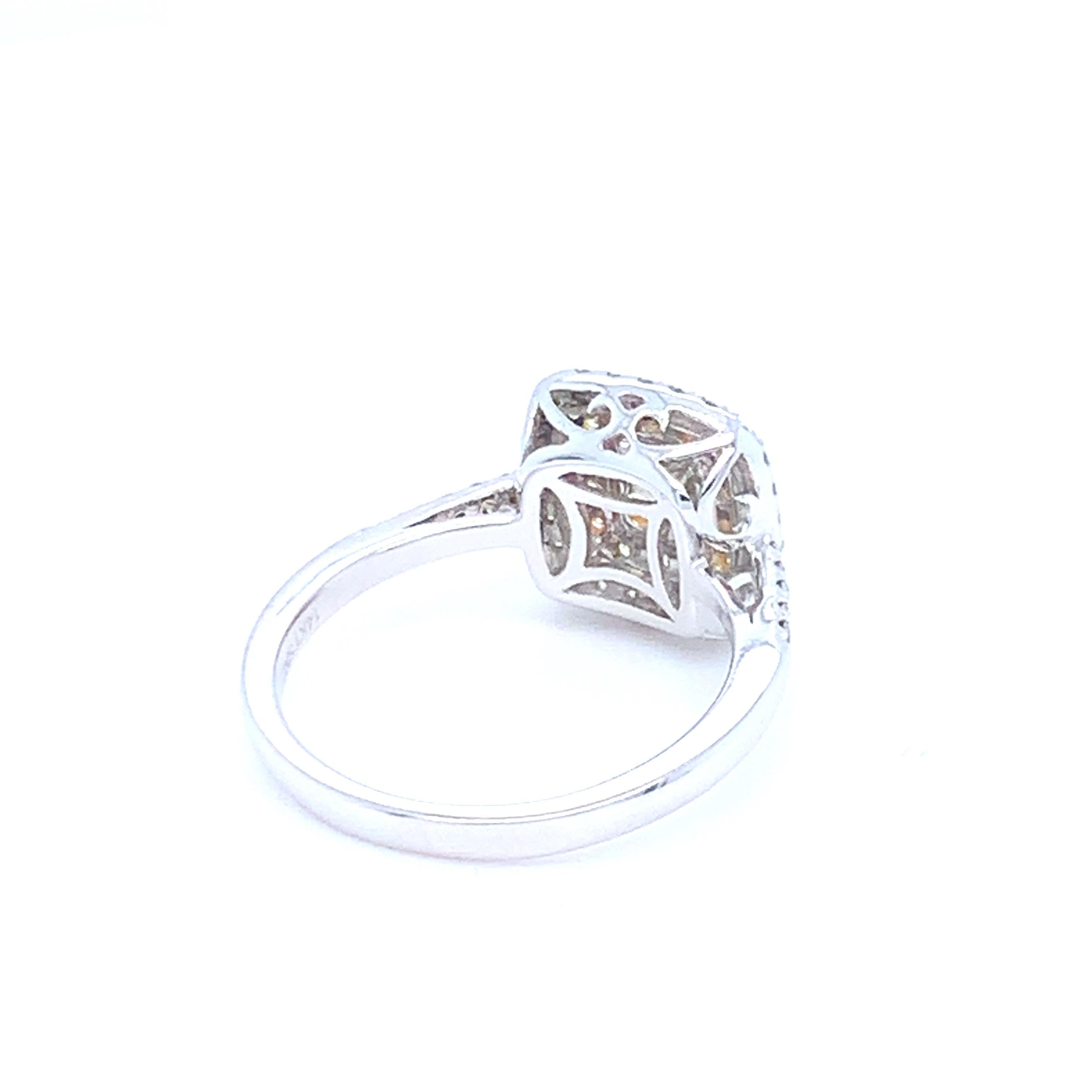 0.62 Carat Cushion Yellow Diamond White Diamond Halo Ring For Sale 4