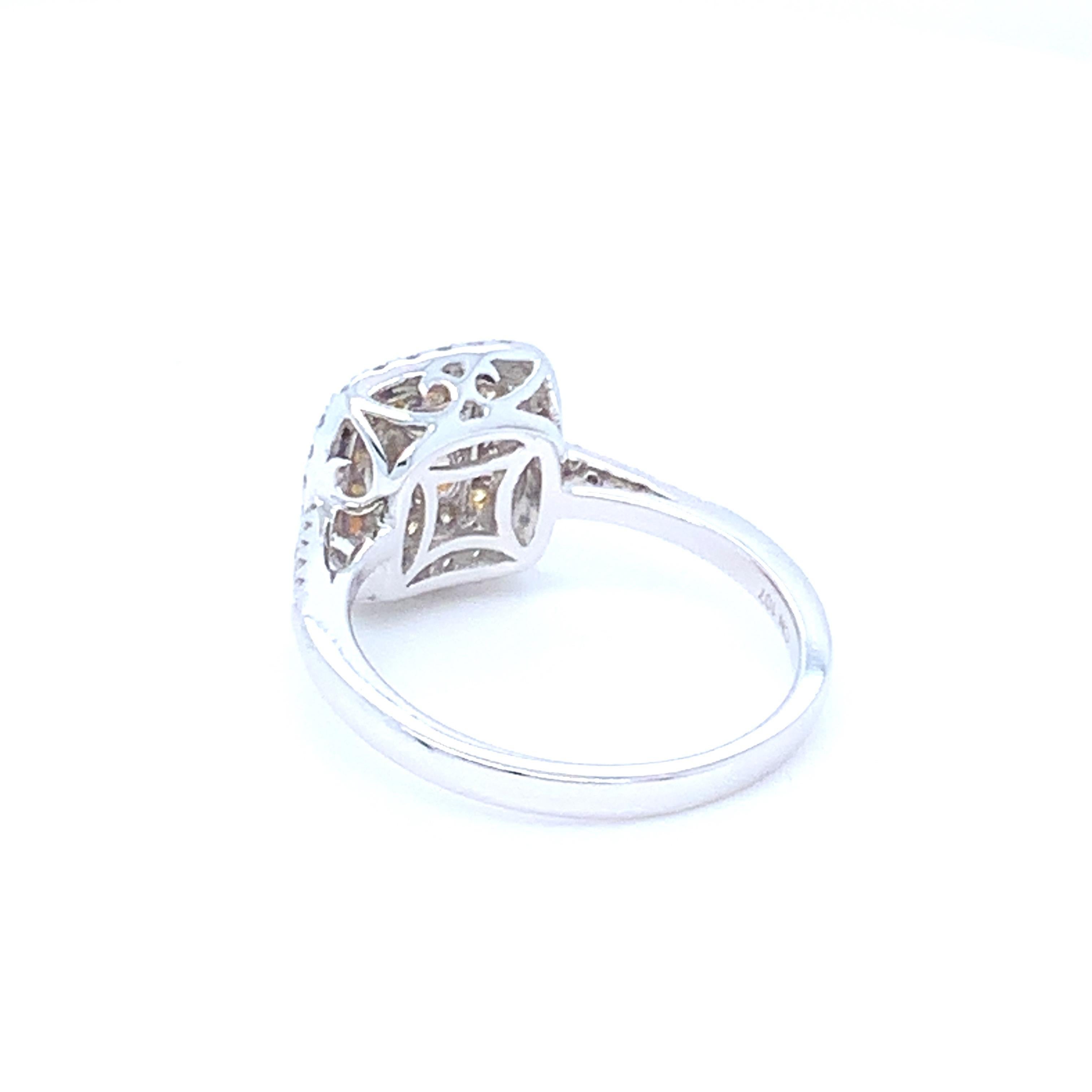 0.62 Carat Cushion Yellow Diamond White Diamond Halo Ring For Sale 6