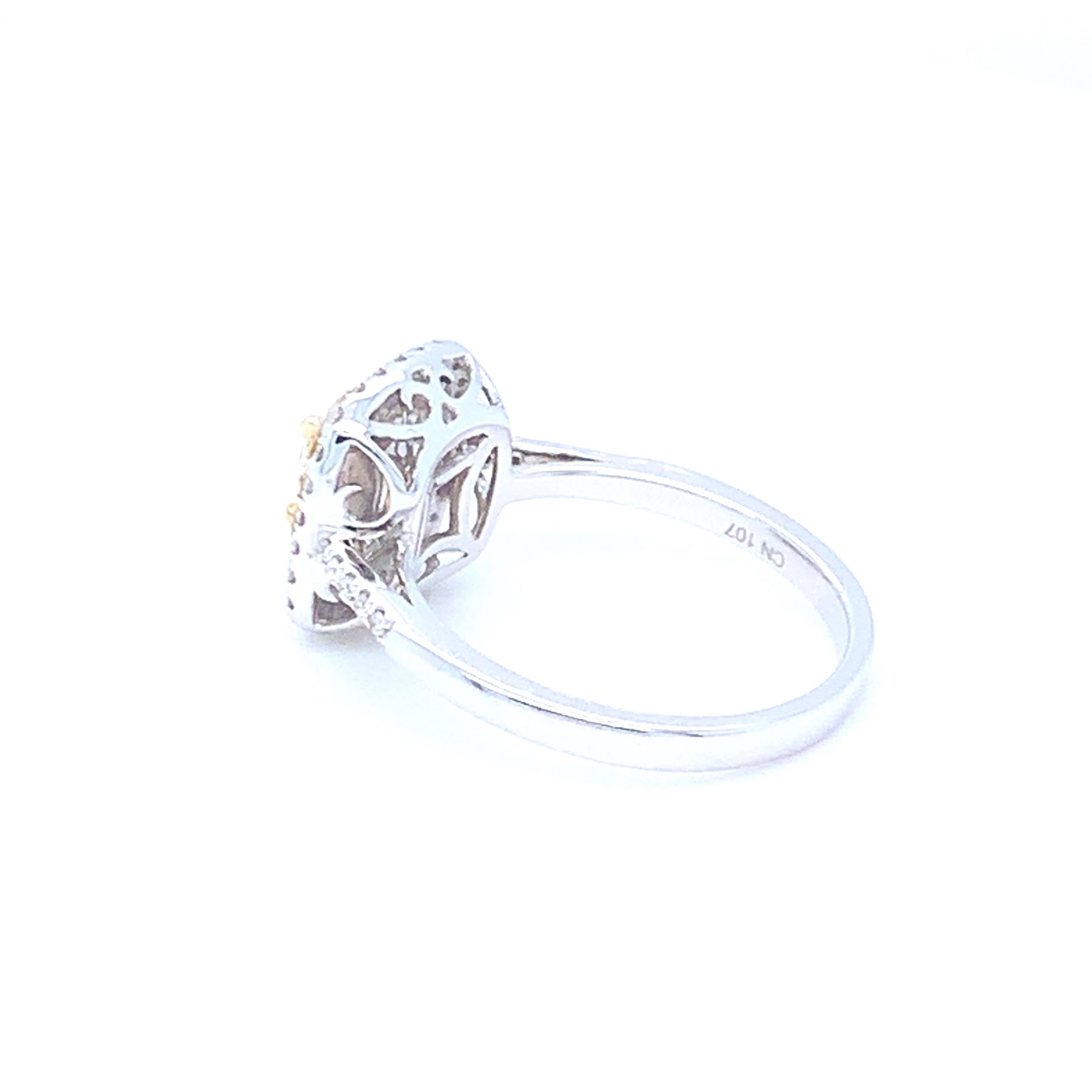 0.62 Carat Cushion Yellow Diamond White Diamond Halo Ring For Sale 7