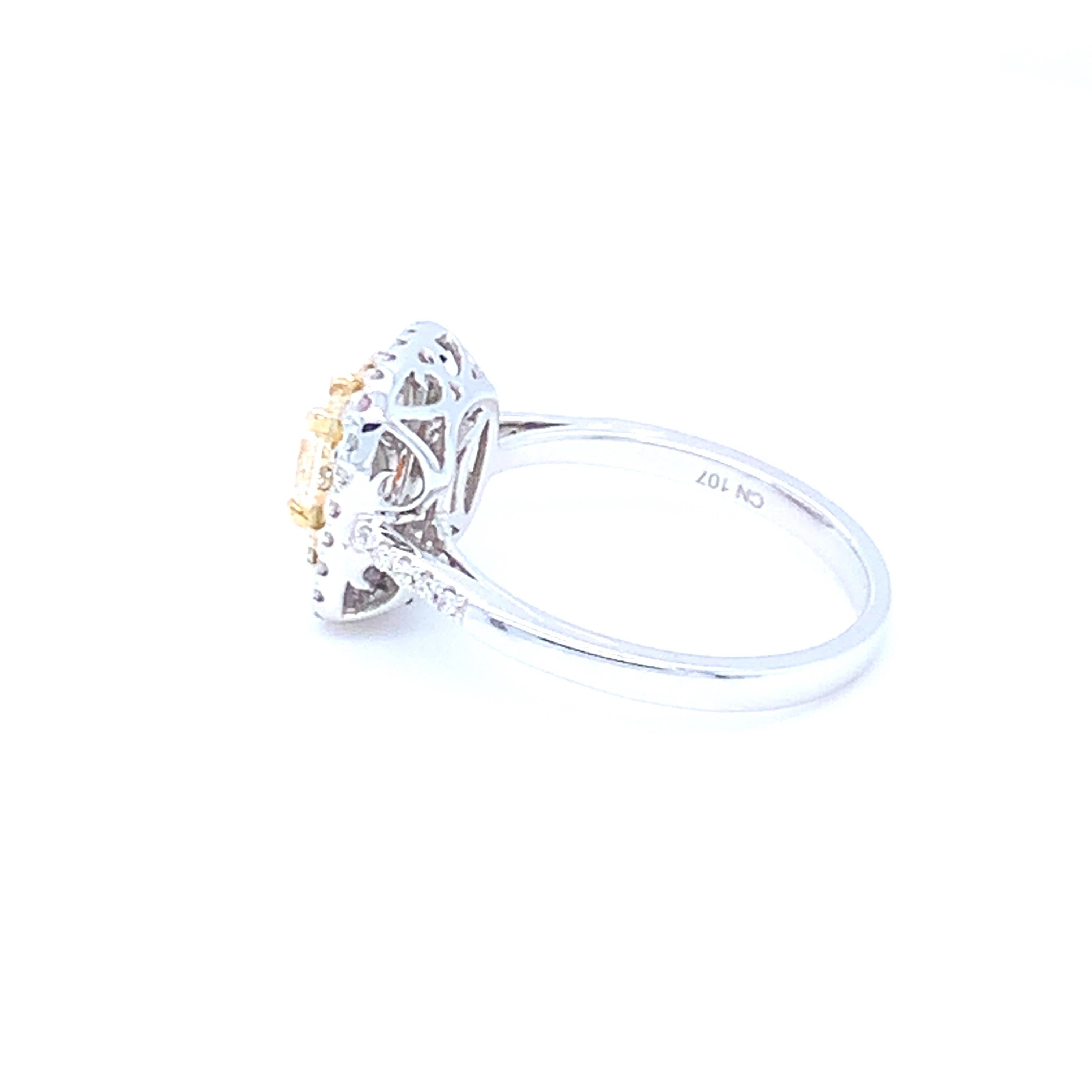 0.62 Carat Cushion Yellow Diamond White Diamond Halo Ring For Sale 8