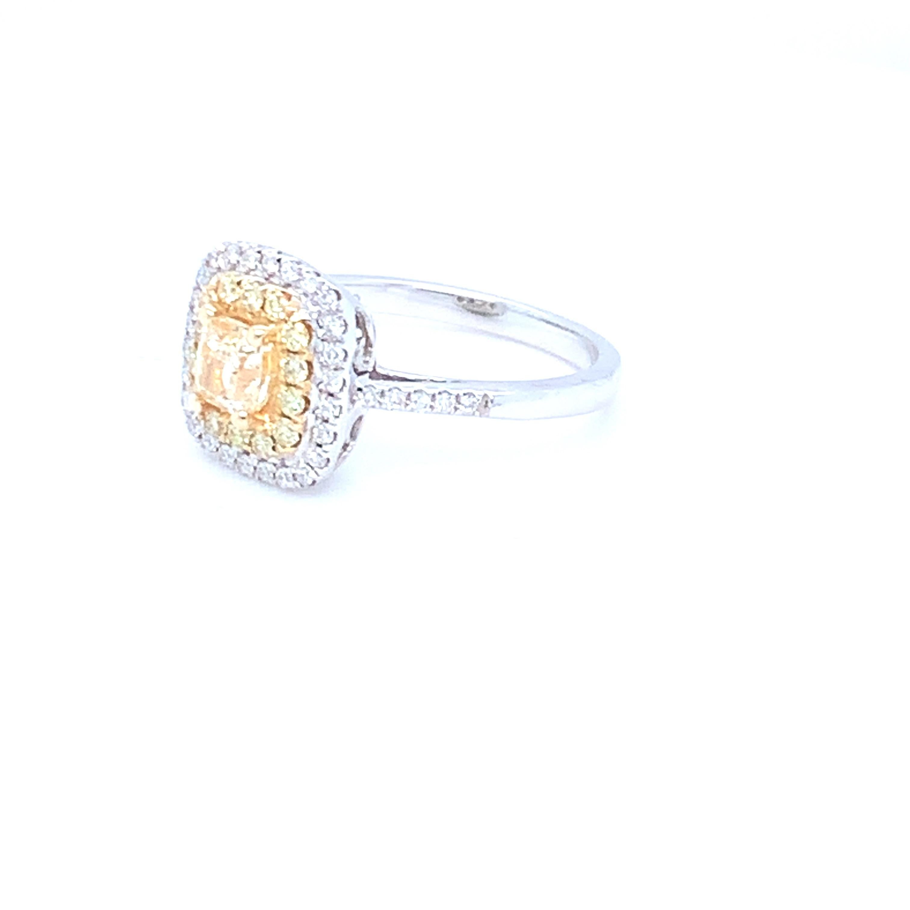 0.62 Carat Cushion Yellow Diamond White Diamond Halo Ring For Sale 9