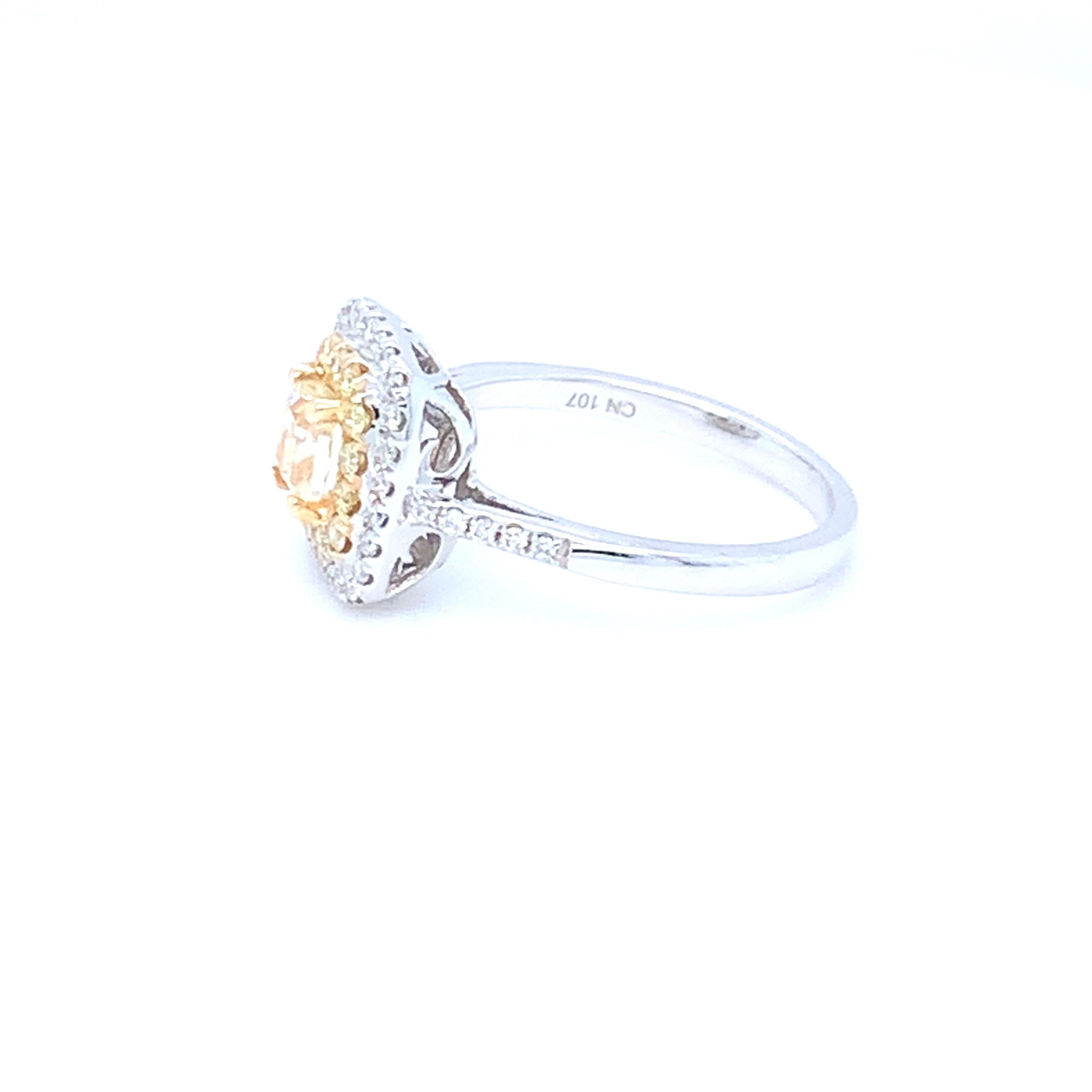 0.62 Carat Cushion Yellow Diamond White Diamond Halo Ring For Sale 10
