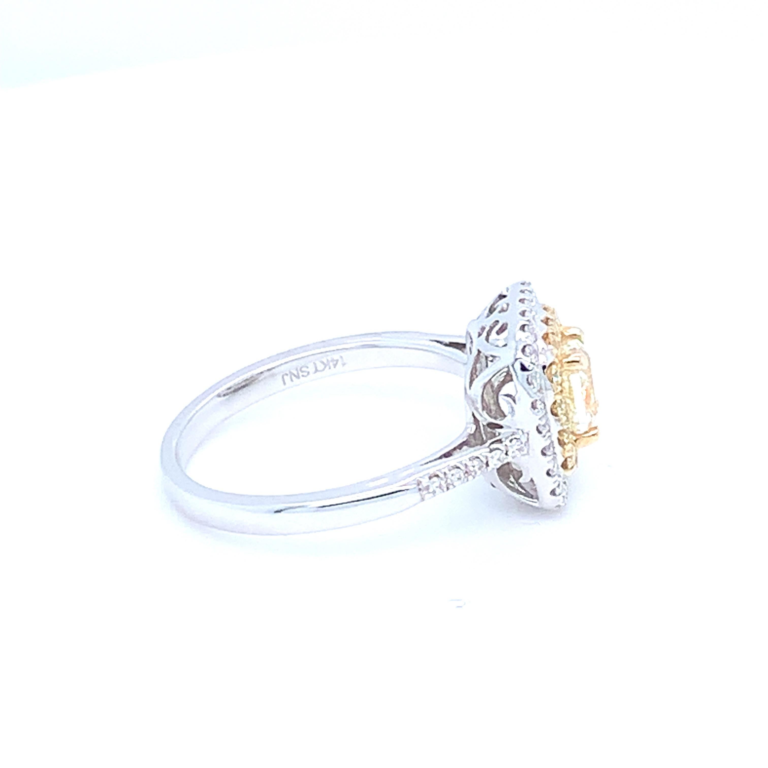 0.62 Carat Cushion Yellow Diamond White Diamond Halo Ring For Sale 1