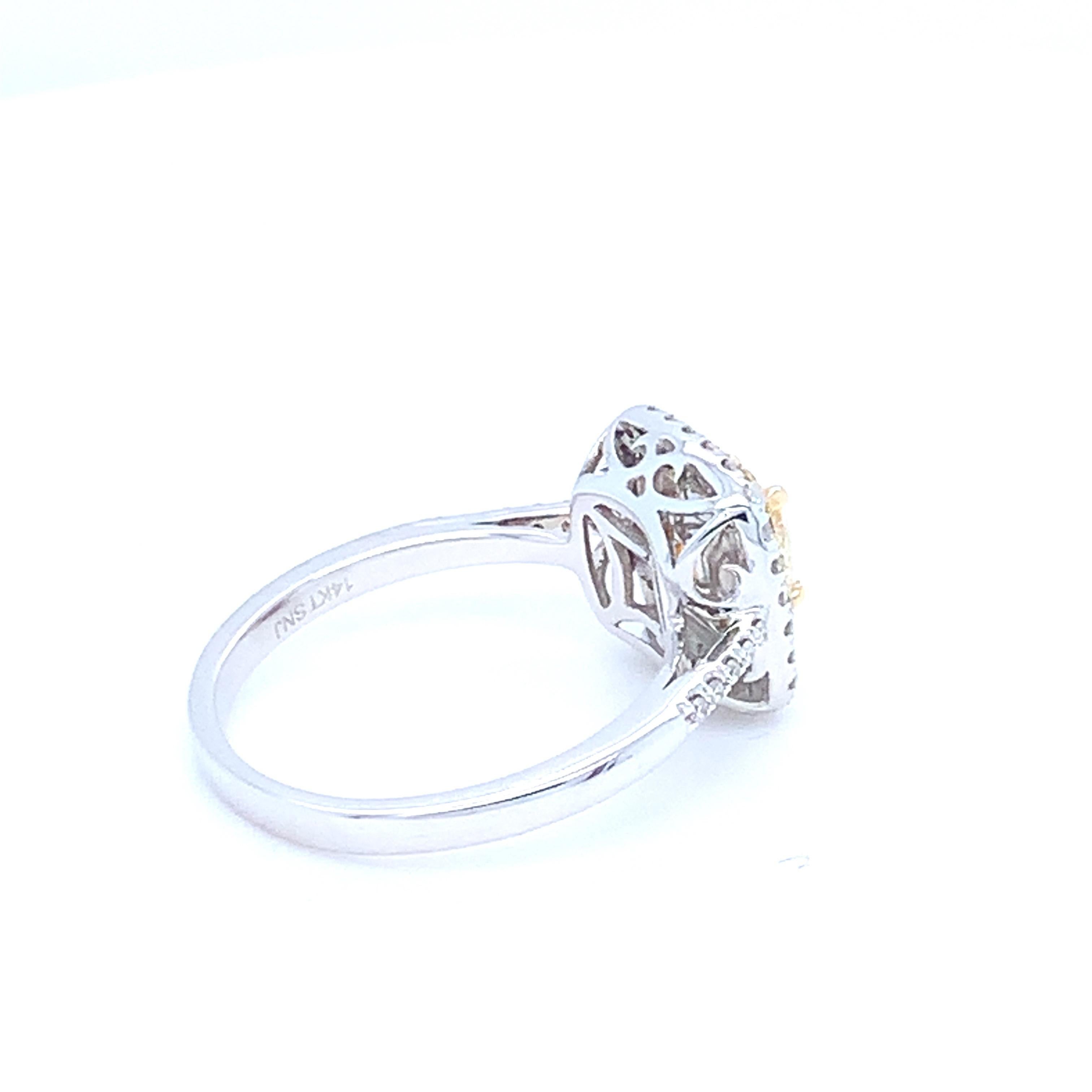 0.62 Carat Cushion Yellow Diamond White Diamond Halo Ring For Sale 2