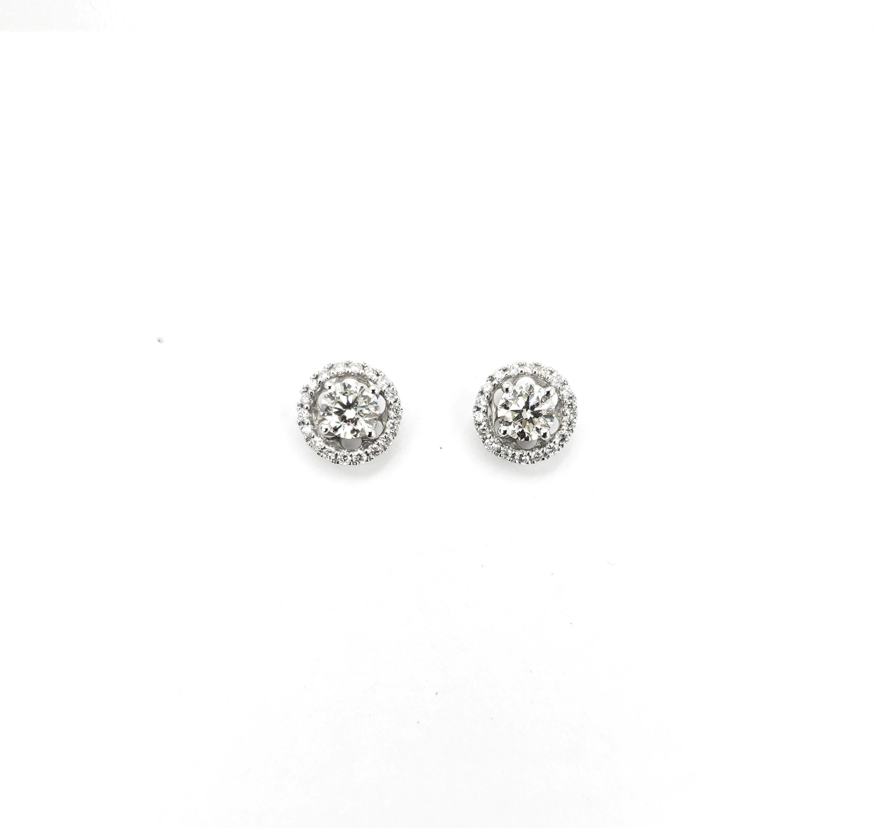 0.62 Carat Diamond Studs with Diamond Halo Jackets in 18 Karat White Gold

Diamond: 0.8ct.
Gold: 18K 2.75g.

Please let us know should you wish to have new earrings made with centre stones of your choice.