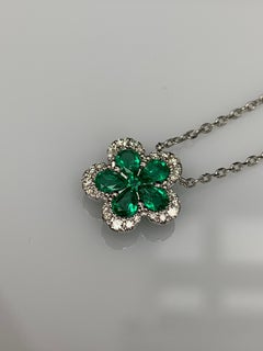 0.62 Carat Flower Emerald and Diamond Pendant Necklace in 18K White Gold
