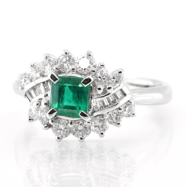 A stunning Halo ring featuring a 0.62 Carat, Natural, Emerald and 0.74 Carats of Diamond Accents set in Platinum. The Emerald displays exceptional color and clarity. People have admired emerald’s green for thousands of years. Emeralds have always