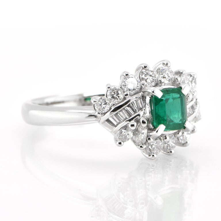 Modern 0.62 Carat, Natural Emerald and Diamond Ring Set in Platinum For Sale