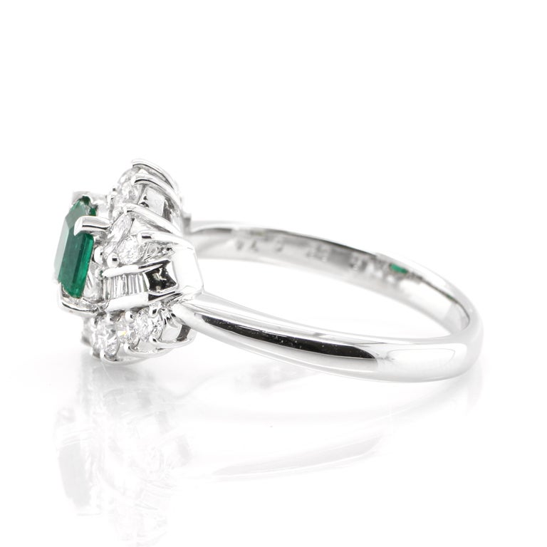 Emerald Cut 0.62 Carat, Natural Emerald and Diamond Ring Set in Platinum For Sale