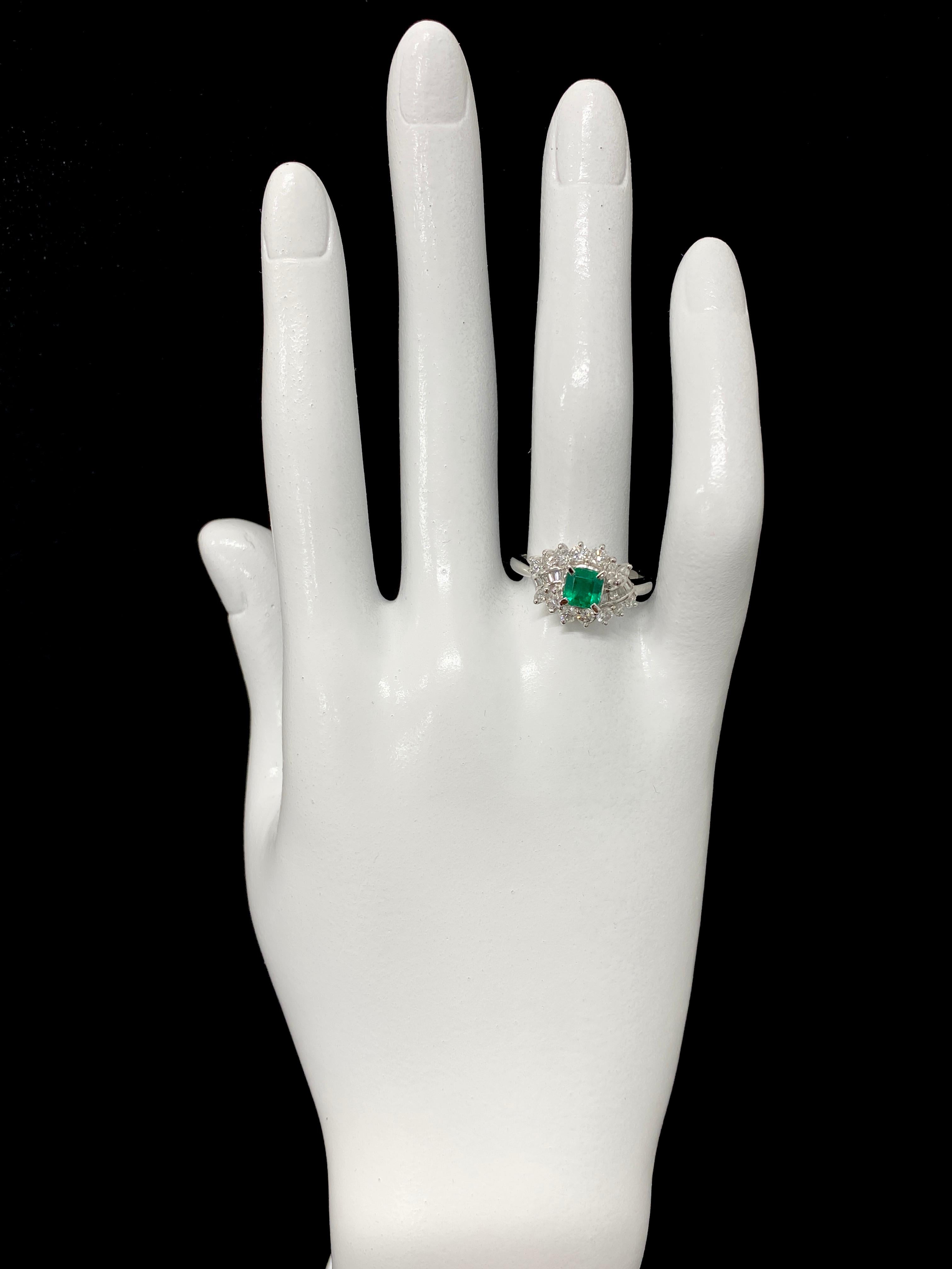 Modern 0.62 Carat Natural Emerald and Diamond Ring Set in Platinum