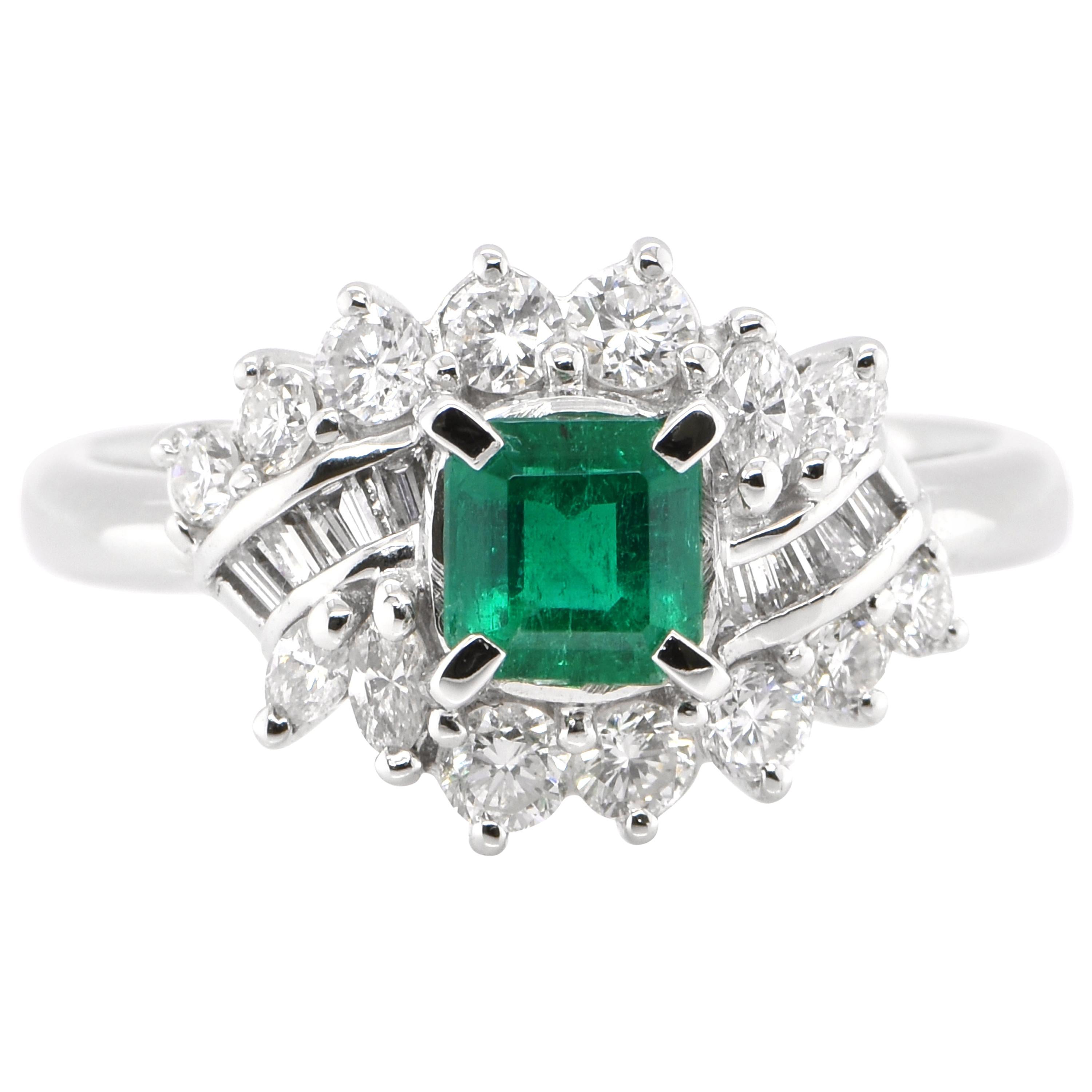 0.62 Carat Natural Emerald and Diamond Ring Set in Platinum