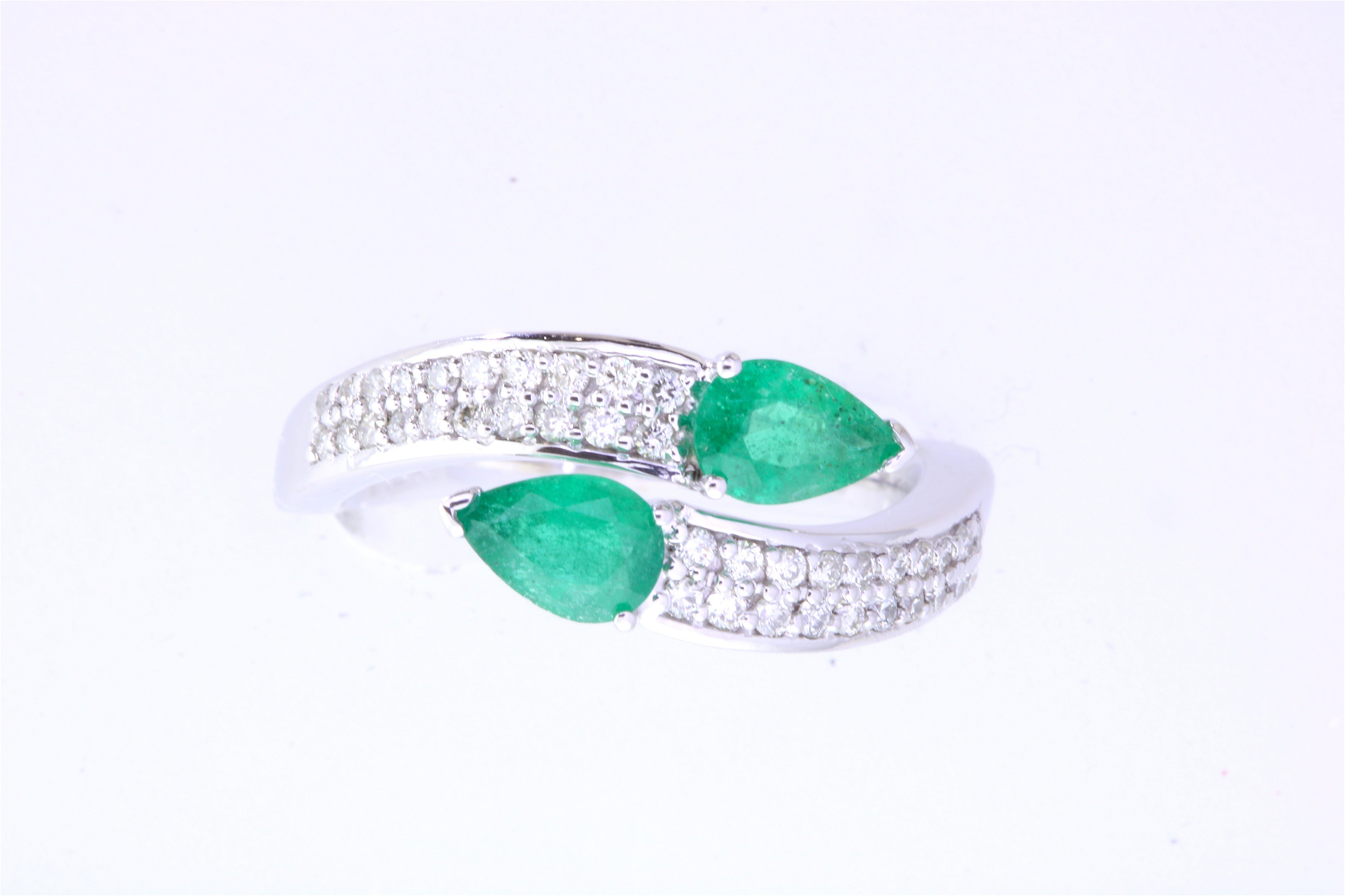Contemporary 0.62 Carat Pear Shaped Emerald and White Diamond Wrap Ring