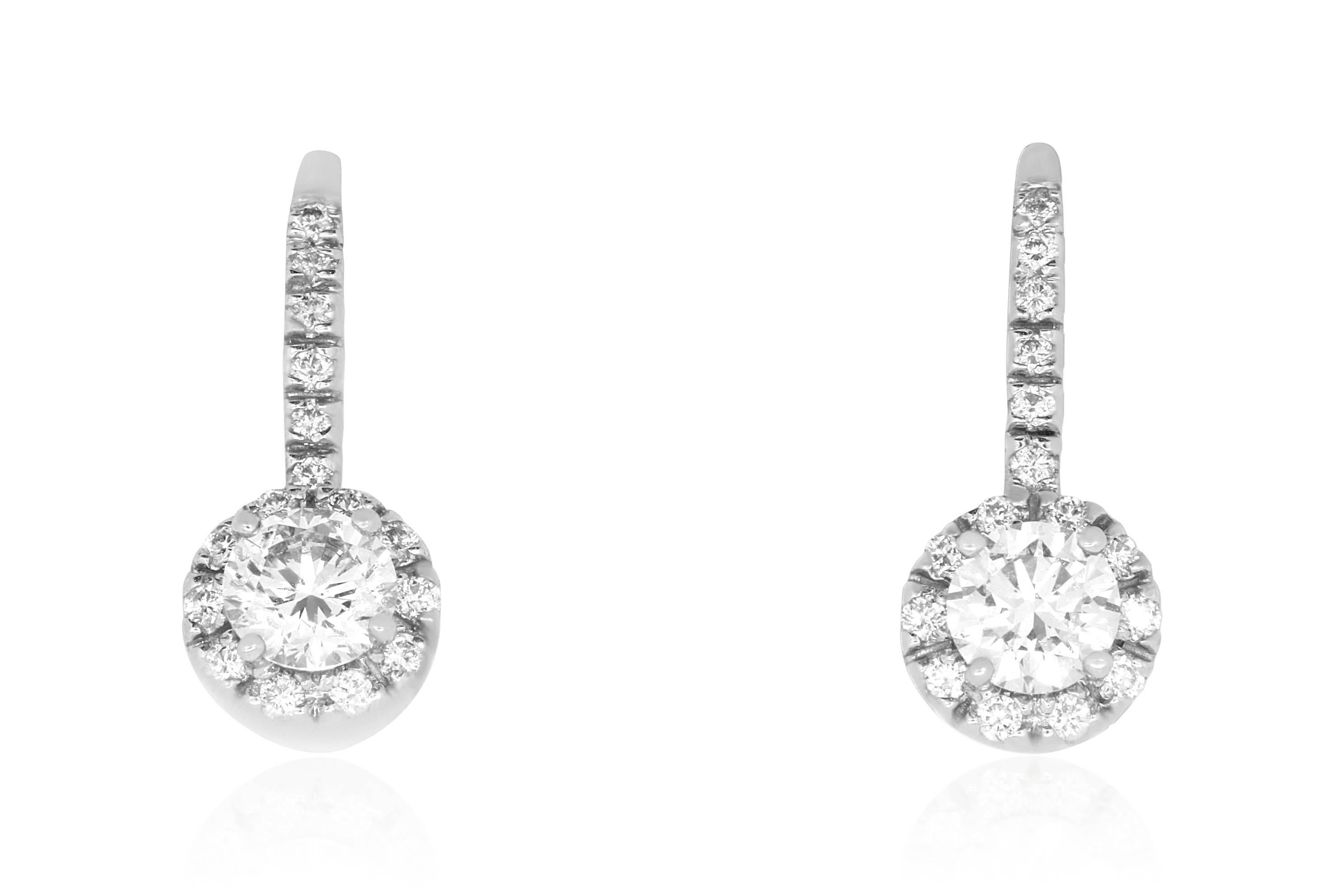 Add some sparkle to any look with these dainty 14k White Gold drop earrings. Featuring a 0.62 Carat Brilliant White Diamond surrounded by 48 Round Diamonds, these will surely become you're favorite pair of earrings! 

Material: 14k White Gold 
Stone