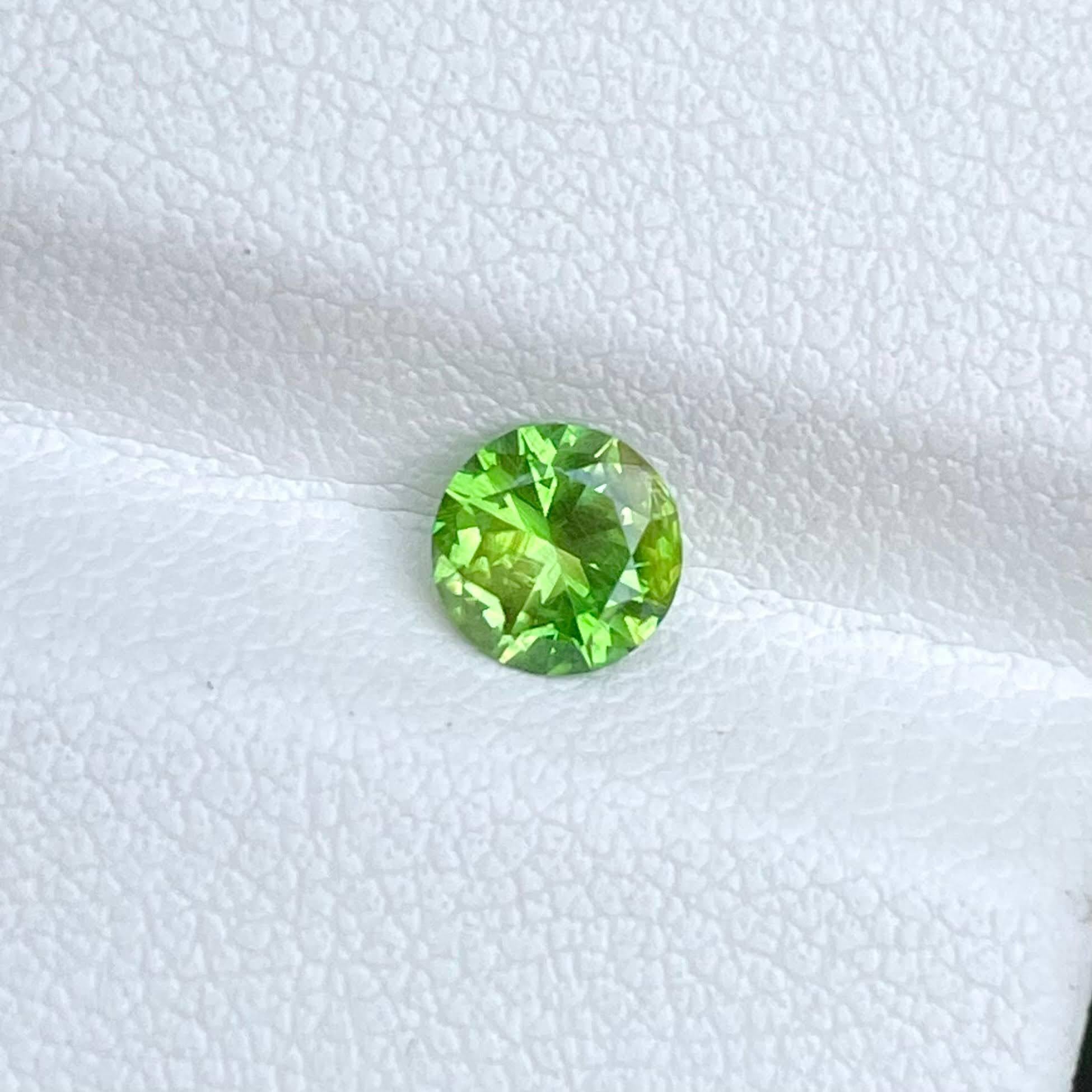 Weight 0.62 carats 
Dim 5.38x3.11 mm
Clarity VVS
Origin Russia
Treatment None
Shape Round
Cut Round Brilliant





The 0.62 carat Demantoid Garnet stone showcases the exquisite beauty of Russian gemstones with its Round Cut, revealing a mesmerizing