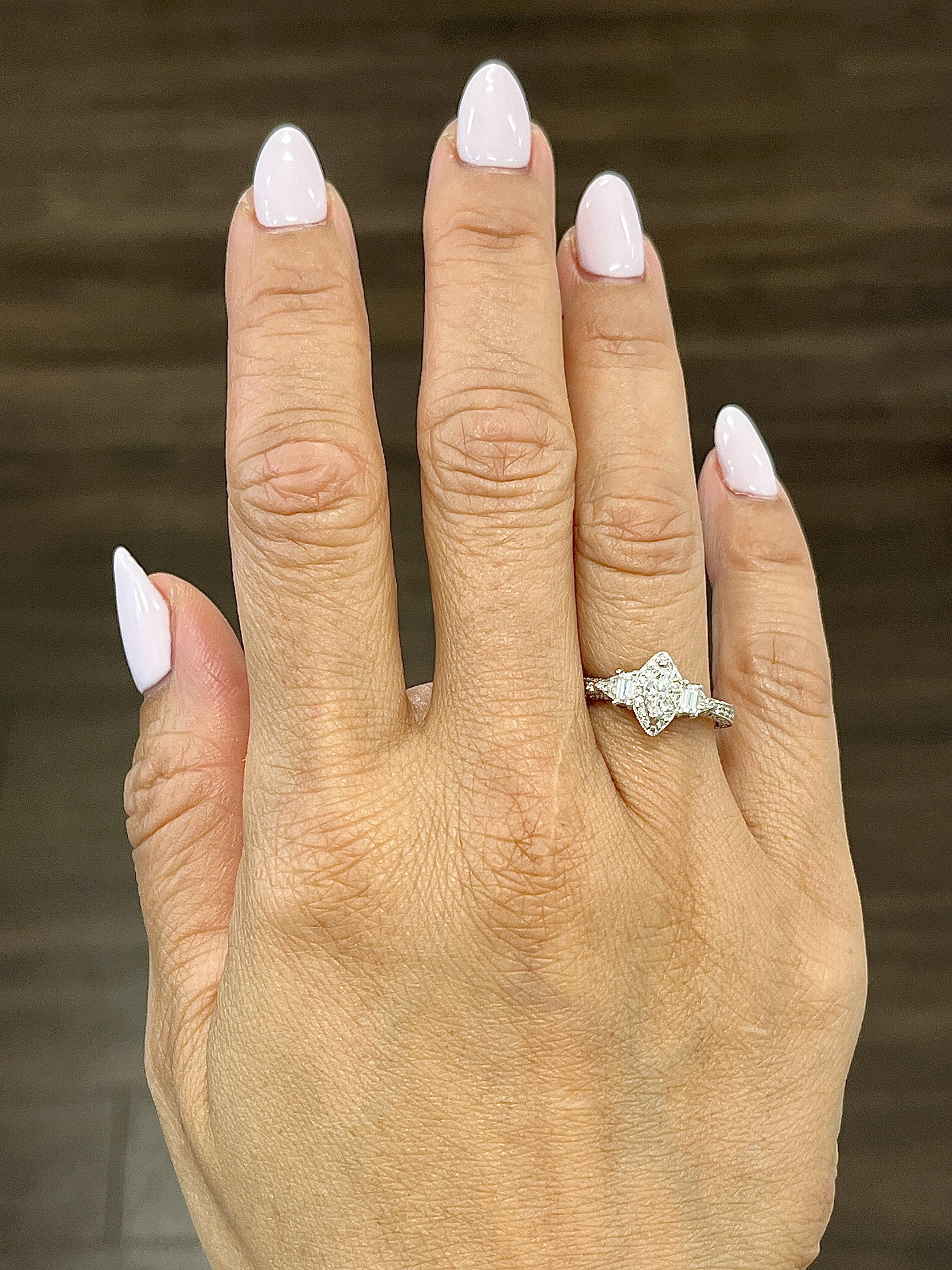 This timeless ring is an elegant addition to any collection. Crafted in the United States in 2023, the ring features a captivating mixed-cut white diamond weighing 0.62 carats. The diamond boasts an F/G color grade and VS2/SI1 clarity, expertly set