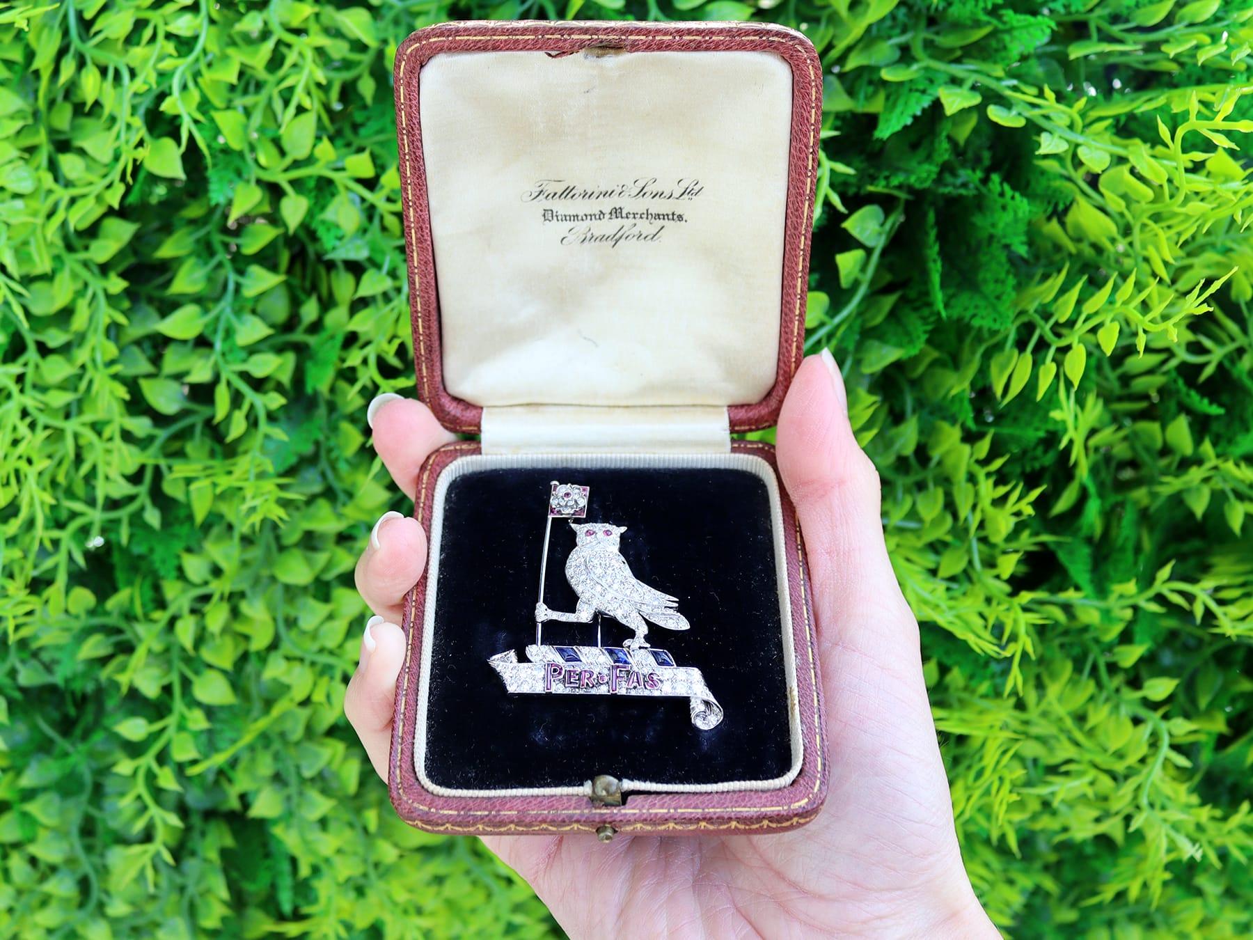 A stunning, fine and impressive vintage 0.62 carat ruby, 0.50 carat sapphire and 3.15 carat diamond, platinum heraldic owl brooch - boxed; part of our diverse collection of diamond brooches.

This fine and impressive vintage diamond brooch has been
