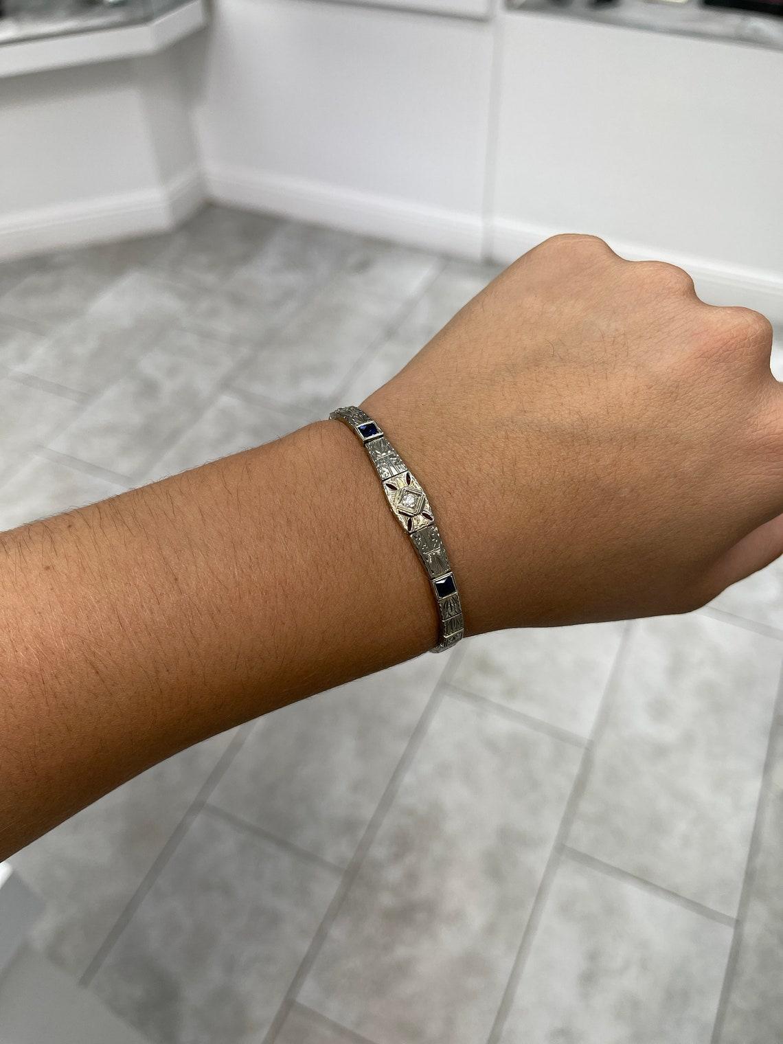 Featured is an original vintage diamond and sapphire bracelet! This bracelet will make a beautiful anniversary, birthday gift, or wonderful addition to your own collection. The round natural diamond weighs XXXXpts with no color shown. Each sapphire