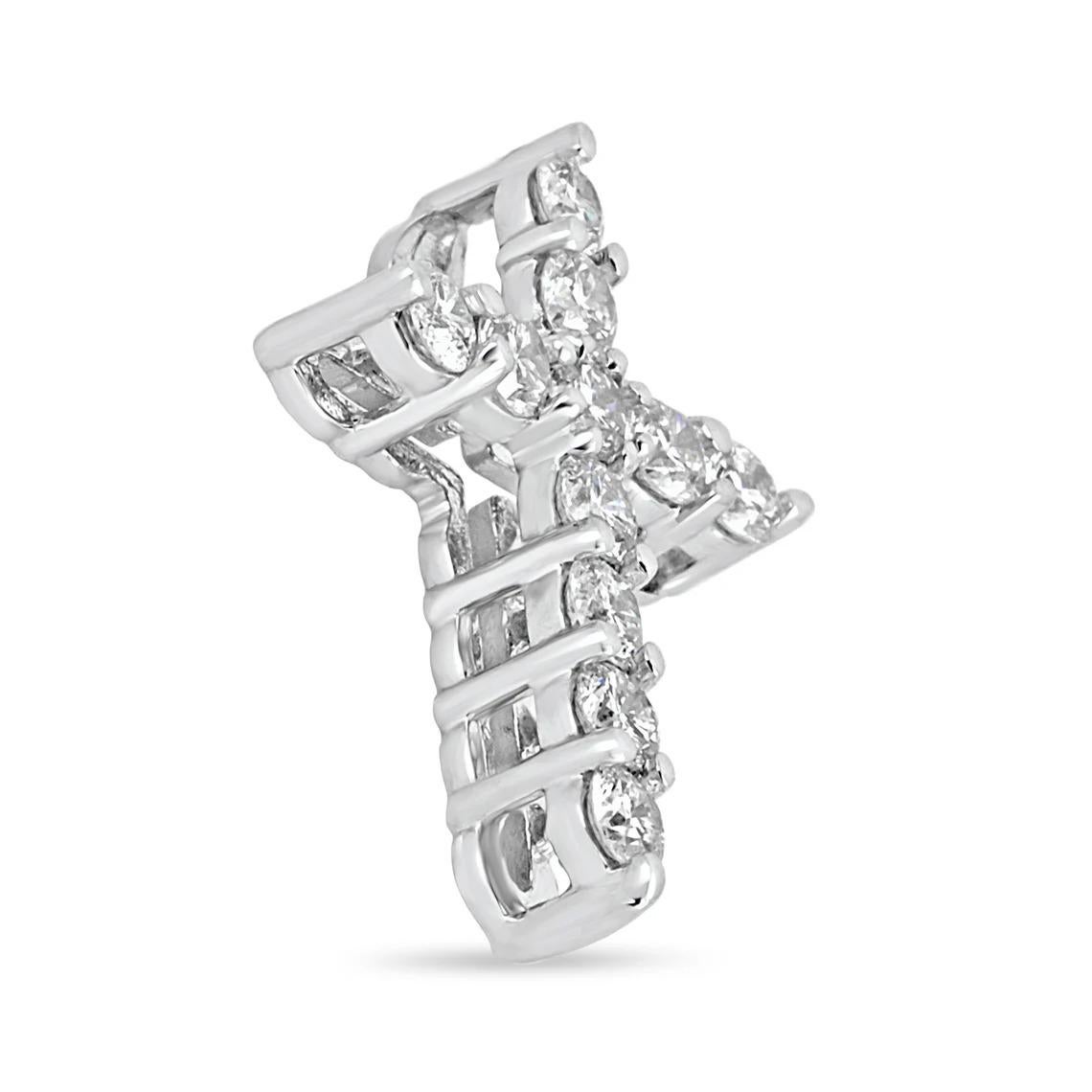 A token of faith. A 14k white gold cross showcases 11 stunning, brilliant round diamonds, prong set. Each diamond is near colorless with very good eye clarity. This pendant is a perfect size, not too small but big enough to be noticed and adored.