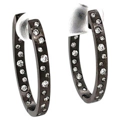 0.63 Carat Diamond Flush Set Oval Hoop Black Gold Earrings