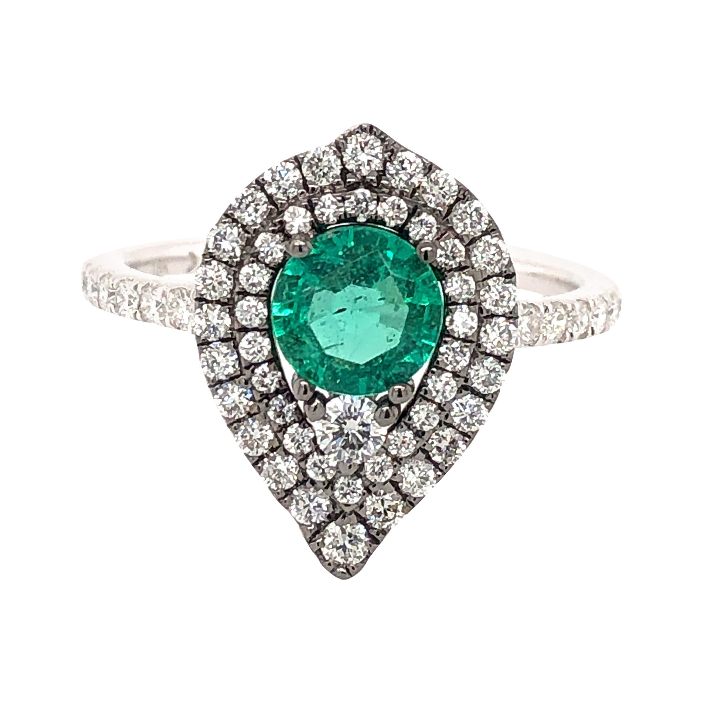 0.63 Carat Emerald and Diamond Ring For Sale