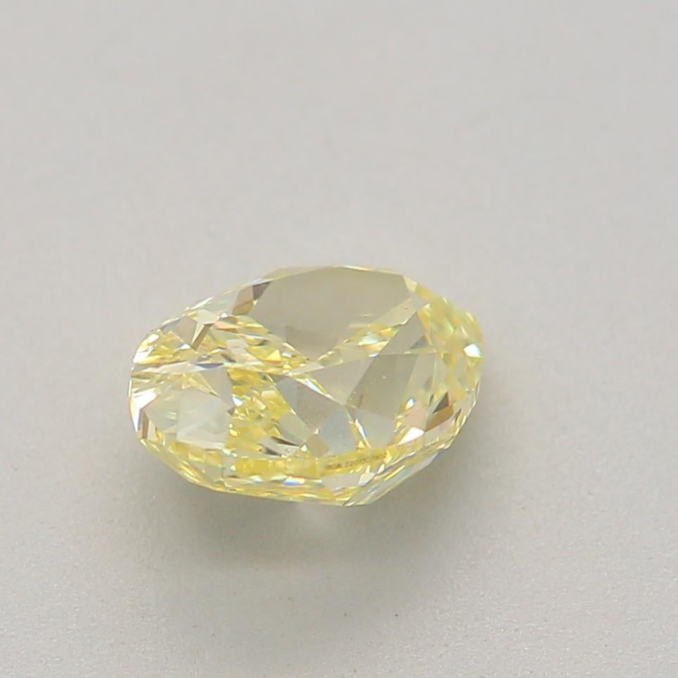 Women's or Men's 0.63 Carat Fancy Light Yellow Oval Cut Diamond VS2 Clarity GIA Certified For Sale