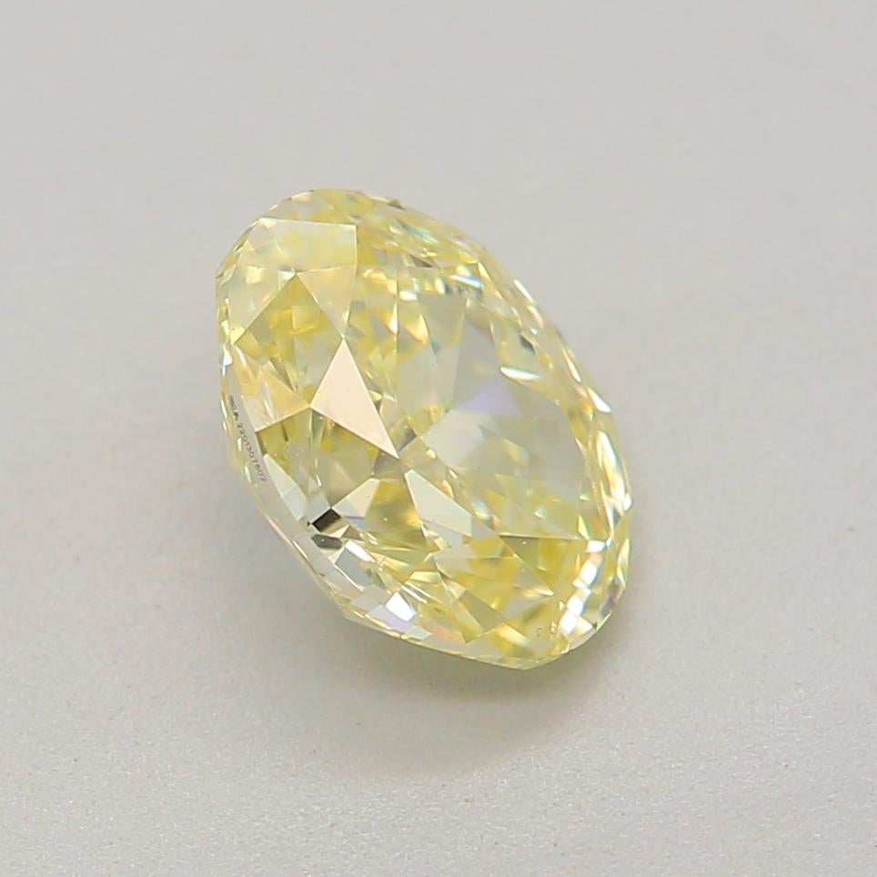 0.63 Carat Fancy Light Yellow Oval Cut Diamond VS2 Clarity GIA Certified For Sale 1