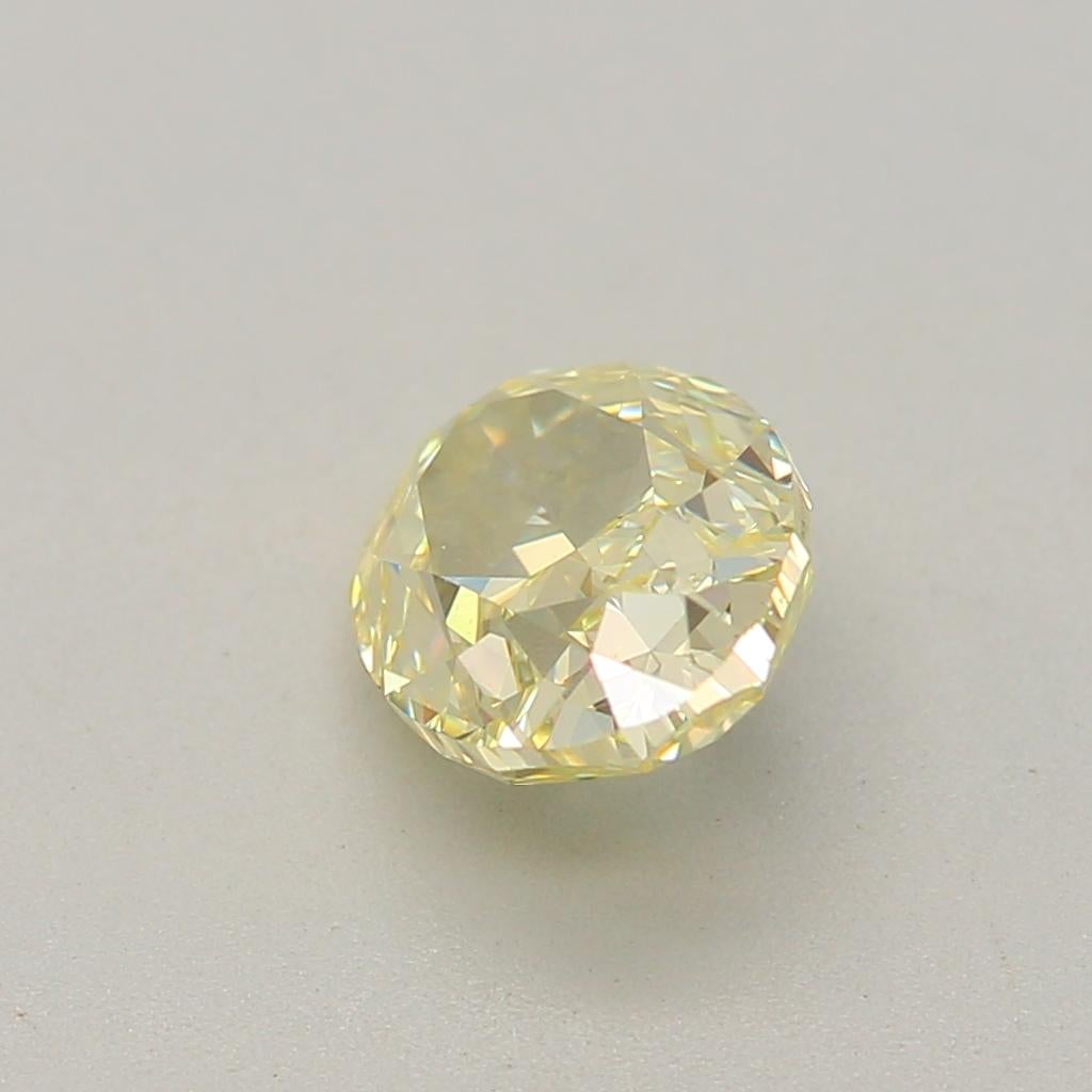 0.63 Carat Fancy Light Yellow Oval Cut Diamond VS2 Clarity GIA Certified For Sale 3