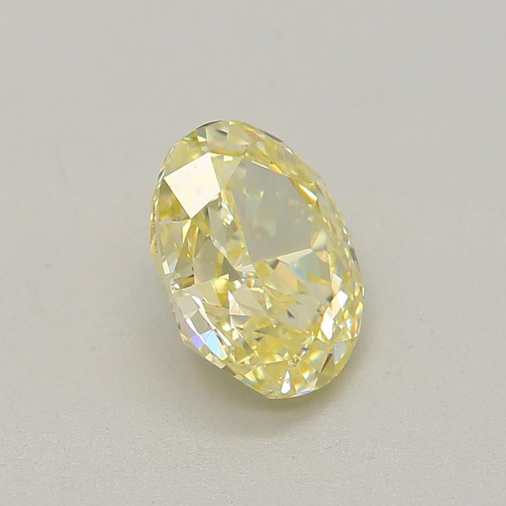 0.63 Carat Fancy Light Yellow Oval Cut Diamond VS2 Clarity GIA Certified For Sale 5