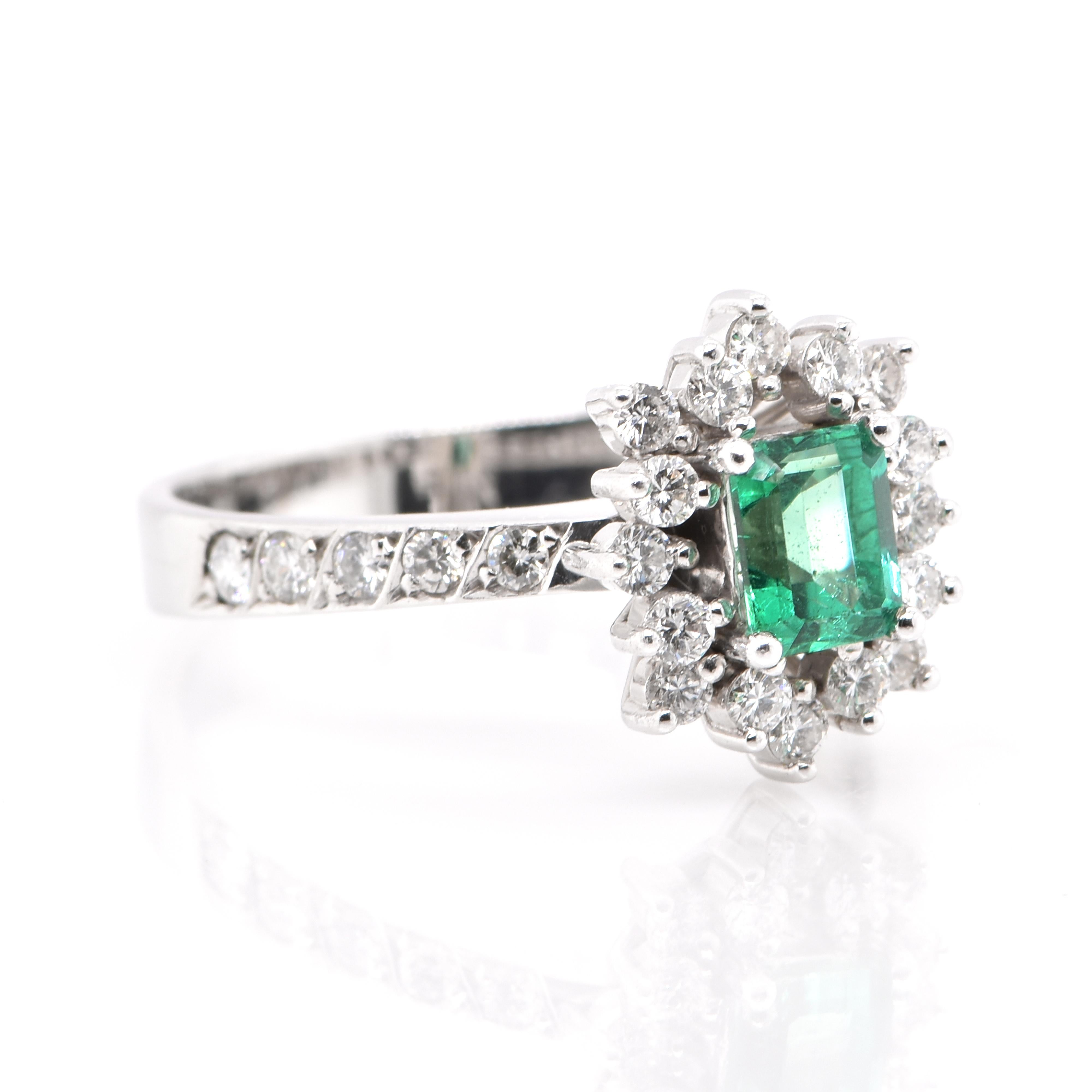 Modern 0.63 Carat Natural Emerald and Diamond Ring Set in Platinum For Sale