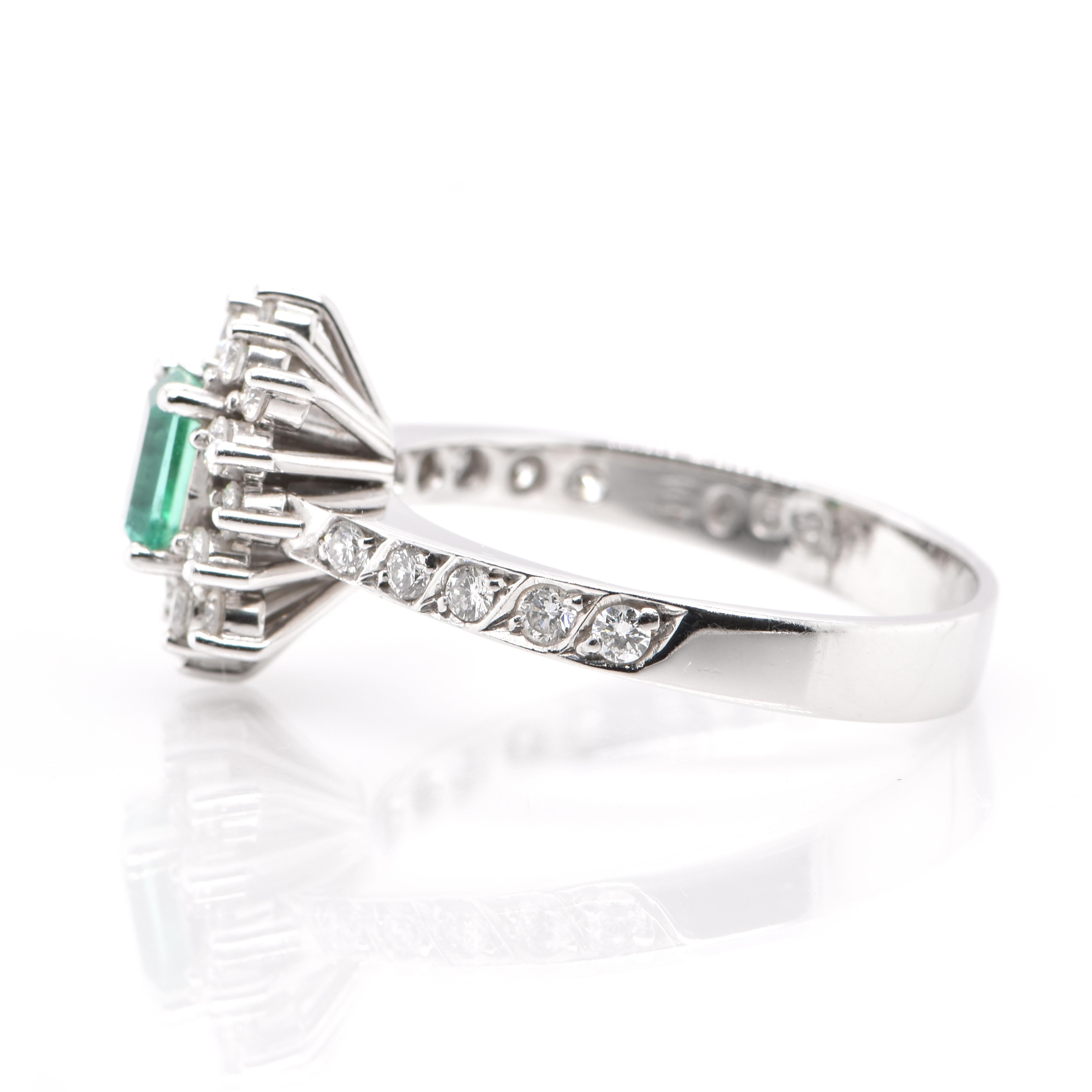 Emerald Cut 0.63 Carat Natural Emerald and Diamond Ring Set in Platinum For Sale