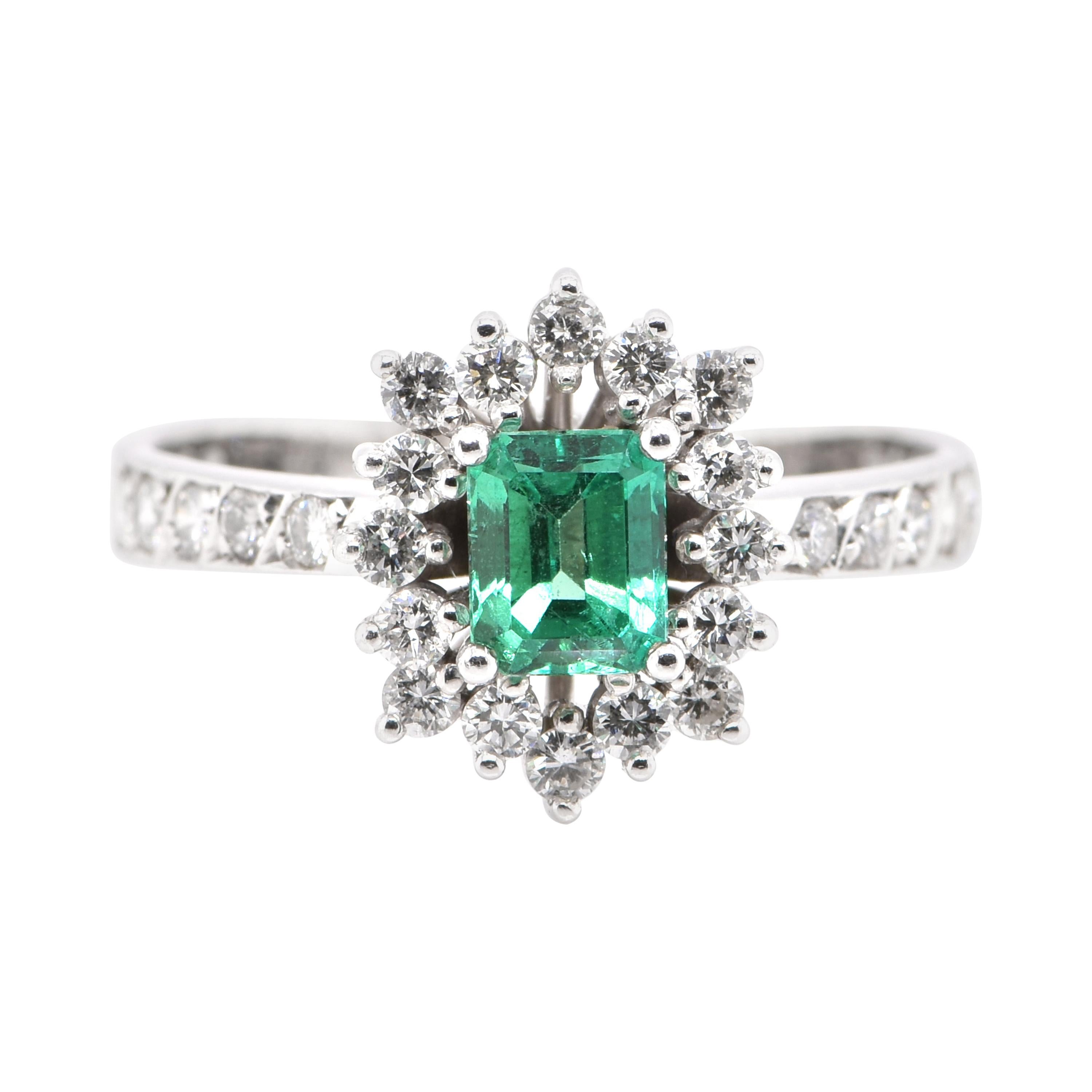 0.63 Carat Natural Emerald and Diamond Ring Set in Platinum For Sale