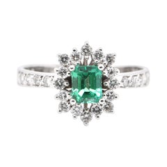 0.63 Carat Natural Emerald and Diamond Ring Set in Platinum