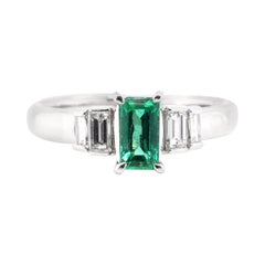 0.63 Carat Natural Vivid Green Emerald and Diamond Ring Set in Platinum