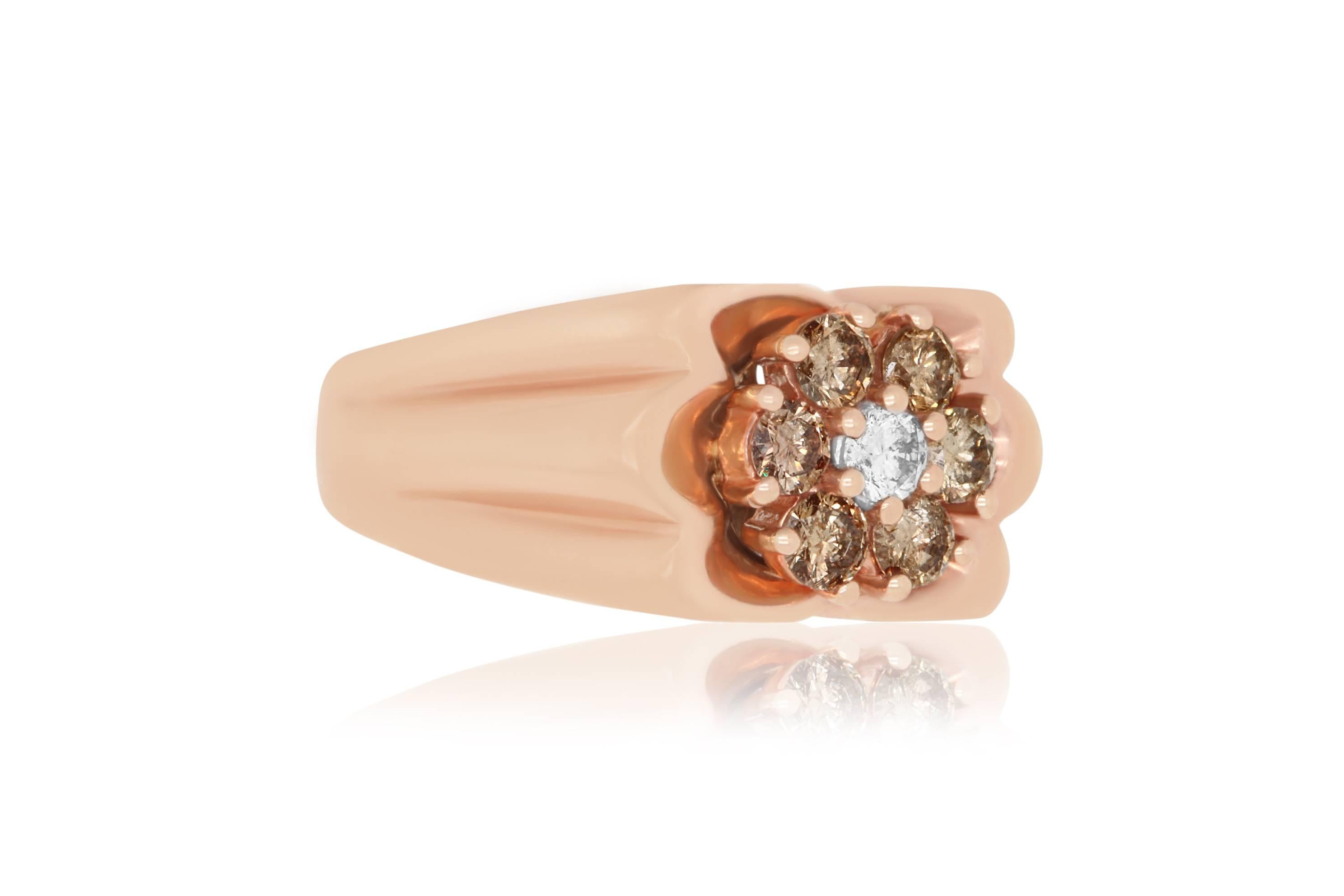 This one of a kind Cognac diamond flower ring isn't a traditional mens style.  Rather than a large center stone, this ring features 6 round Cognac diamonds encircling a single round White Diamond to complete this dainty flower look.

Material: 14k