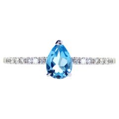 Bague en topaze bleue en forme de poire naturelle de 0,63 carat et diamants
