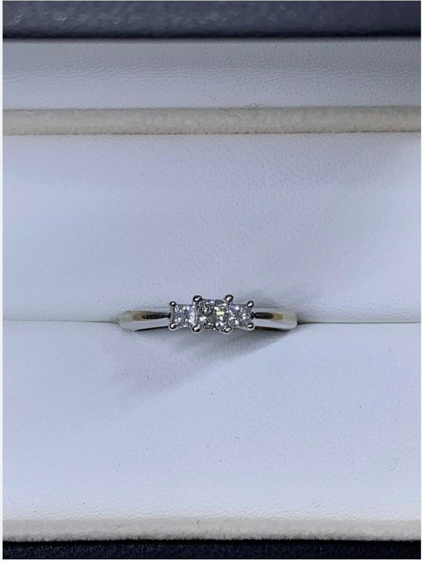 0.63ct Princess Diamond Trilogy Engagement Ring In 18ct White Gold
Spoil your future spouse with this 0.63ct Princess Diamond Trilogy Engagement Ring by Trilogy. Crafted in 18ct White Gold, this stunning ring features a trio of natural, excellent
