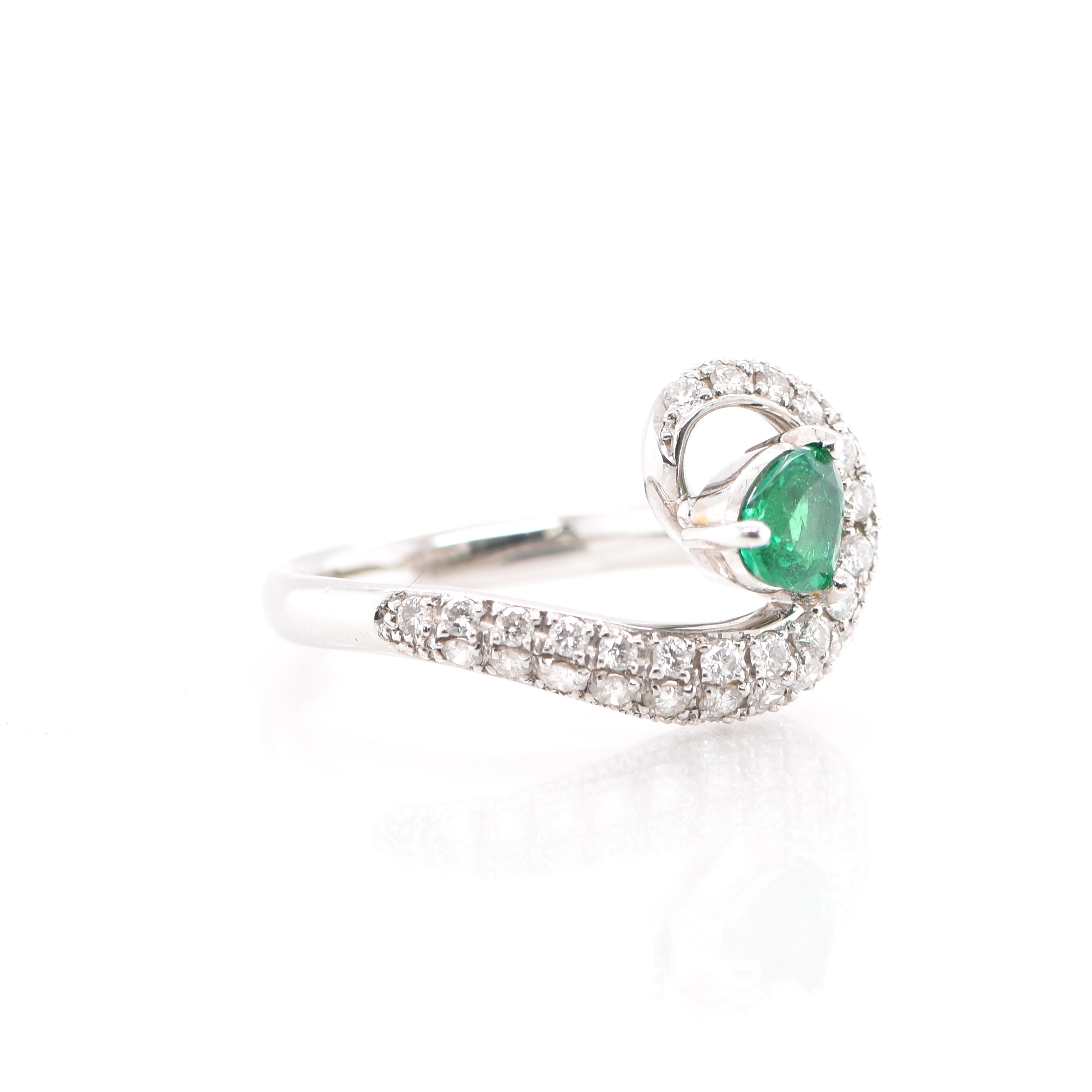 Modern 0.64 Carat Natural Emerald and Diamond Ring Set in Platinum