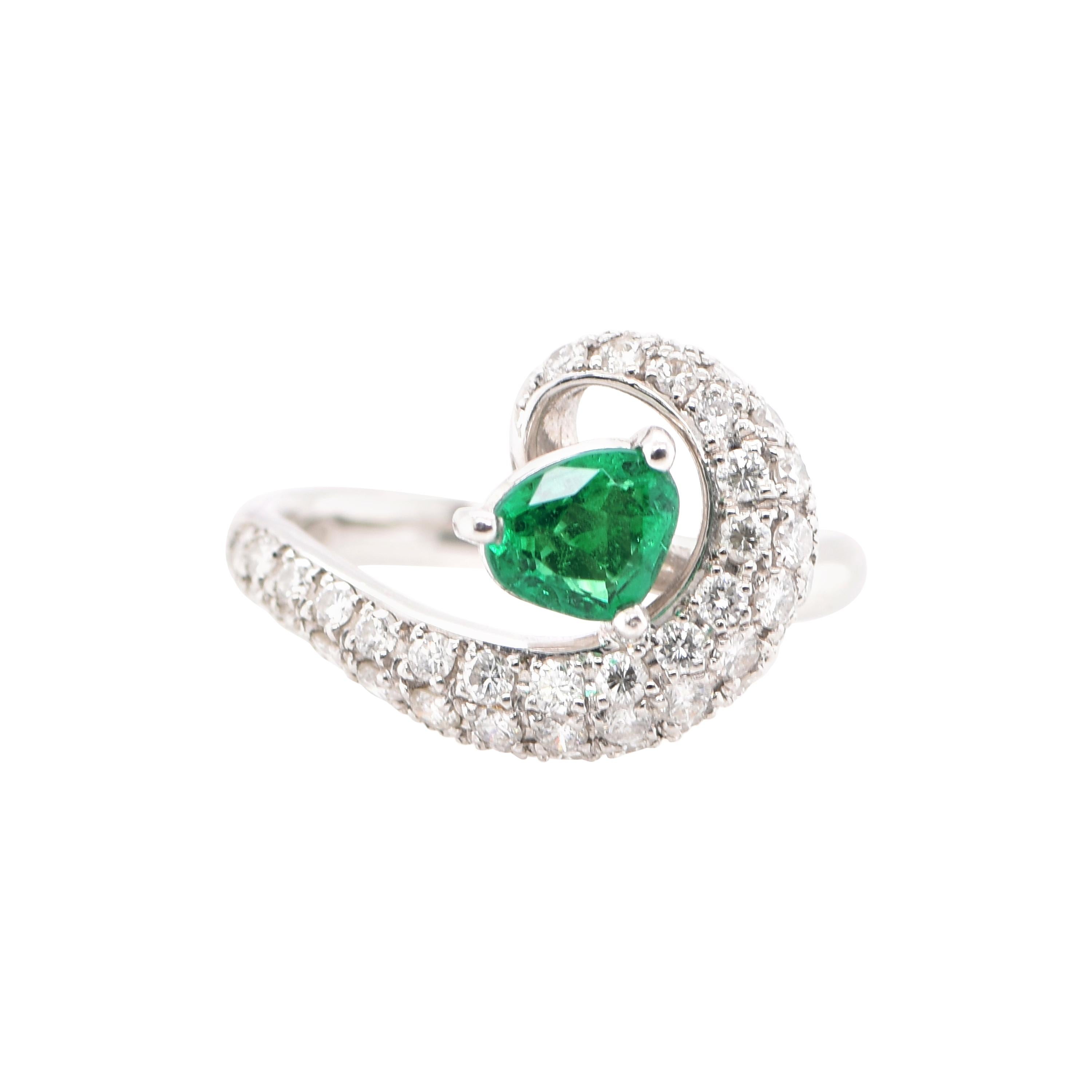 0.64 Carat Natural Emerald and Diamond Ring Set in Platinum