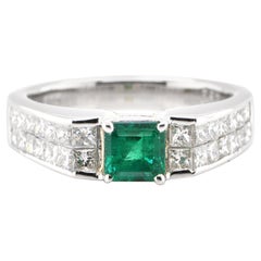 0.64 Carat Natural Emerald and Diamond Ring Set in Platinum