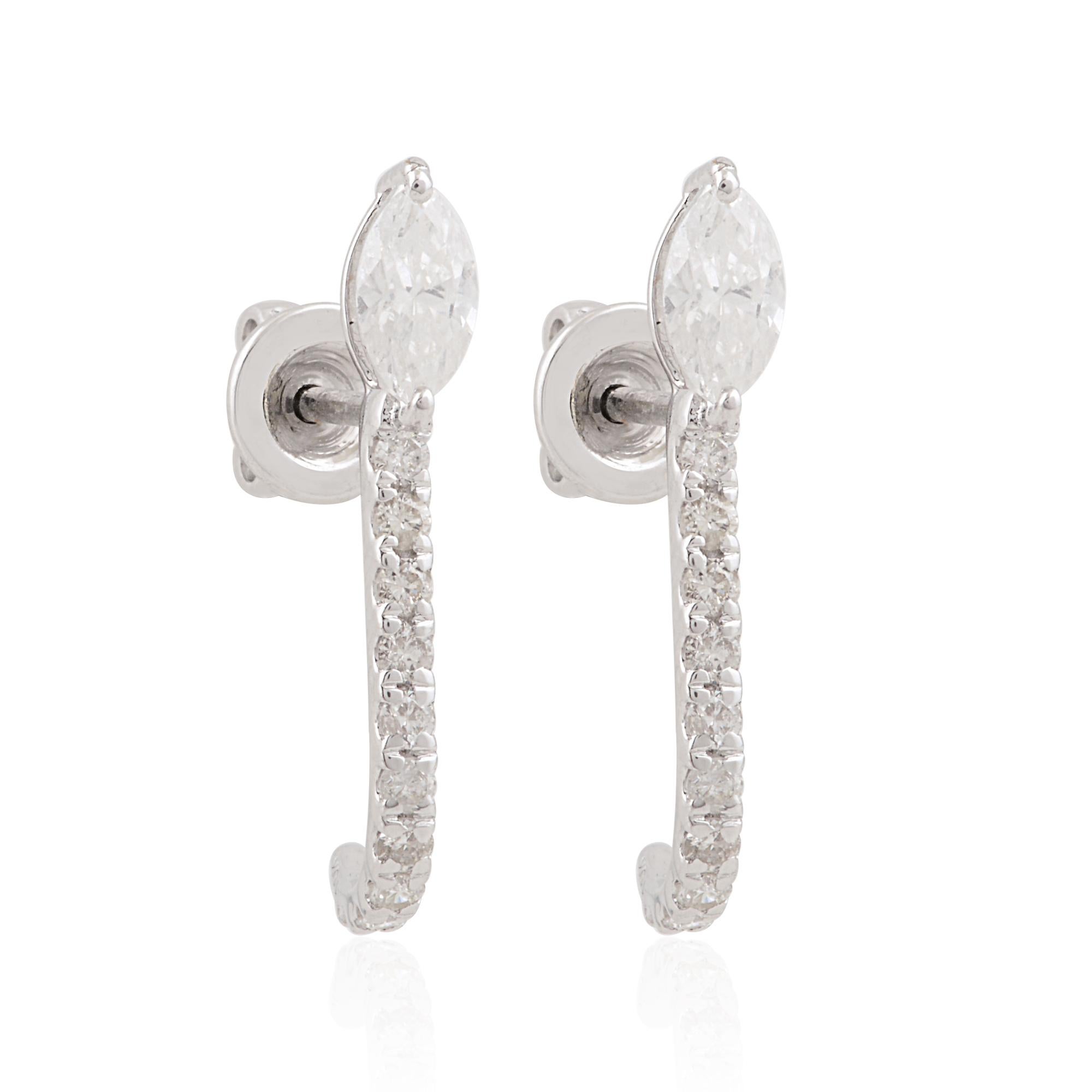 Indulge in the timeless elegance of these exquisite half hoop earrings, adorned with dazzling marquise-cut diamonds set in lustrous 10 karat white gold. Each earring features a total of 0.64 carats of shimmering diamonds, carefully selected for